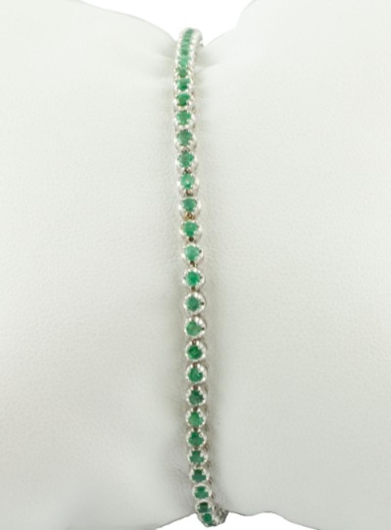 Modern Tennis Bracelet in 18 Karat White Gold and Emeralds