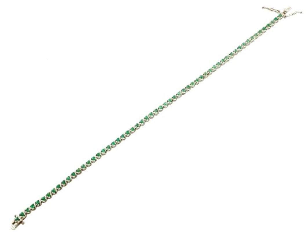 Round Cut Tennis Bracelet in 18 Karat White Gold and Emeralds