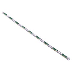 Tennis Bracelet in Platinum with Diamonds and Green Emeralds