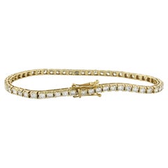 Bracciale tennis con diamanti incastonati in oro giallo 14k