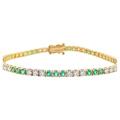 Tennisarmband aus 14 Karat Gelbgold mit weißenen Diamanten 2,00 Karat & grünem Smaragd 1,80CT