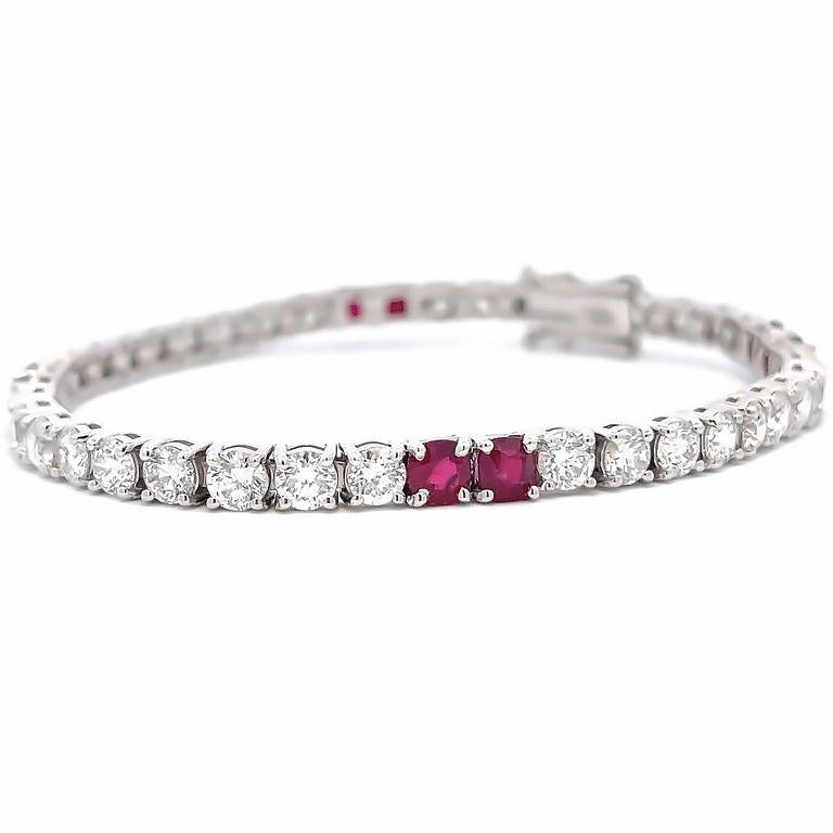 Looking to add a touch of elegance to your look? This classic tennis bracelet is the perfect choice. Made from polished 14K white gold, it boasts a bright luster that catches the eye. With round white diamonds weighing 6.62 carats and ruby Burma