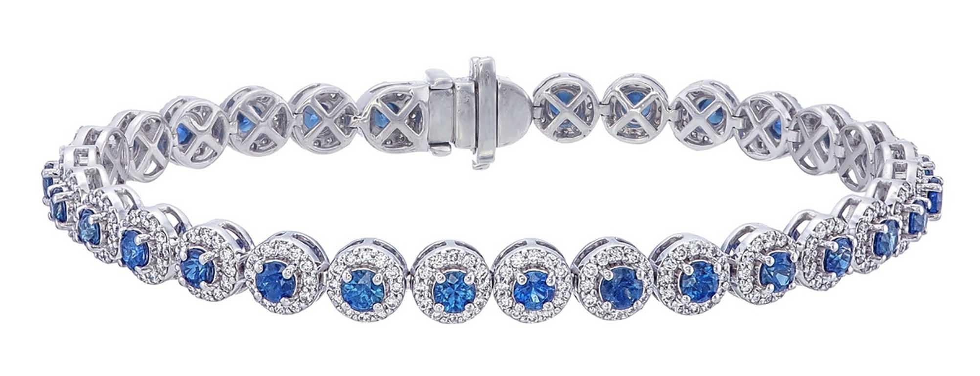Brilliant Cut Tennis bracelet with Blue sapphire and a halo of diamond all around  For Sale