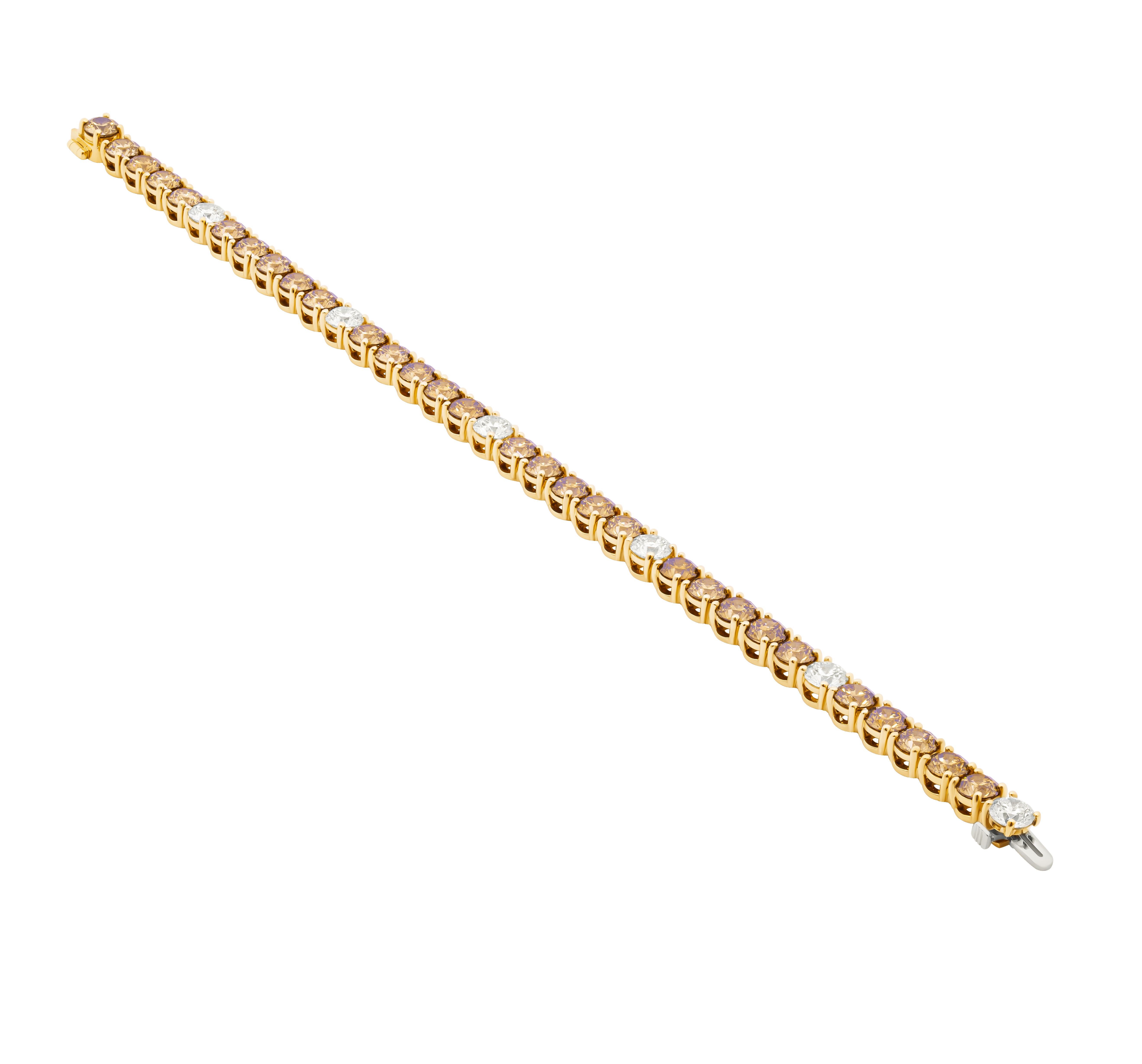 Tennis Bracelet with Champagne & White Diamonds
Mounted in 14K Yellow Gold
Champagne Diamonds each stone 0.36ct, totaling 10.08ct
White diamonds 6 stones each stone 0.40ct totaling 2.40CT

6.5 inches long
