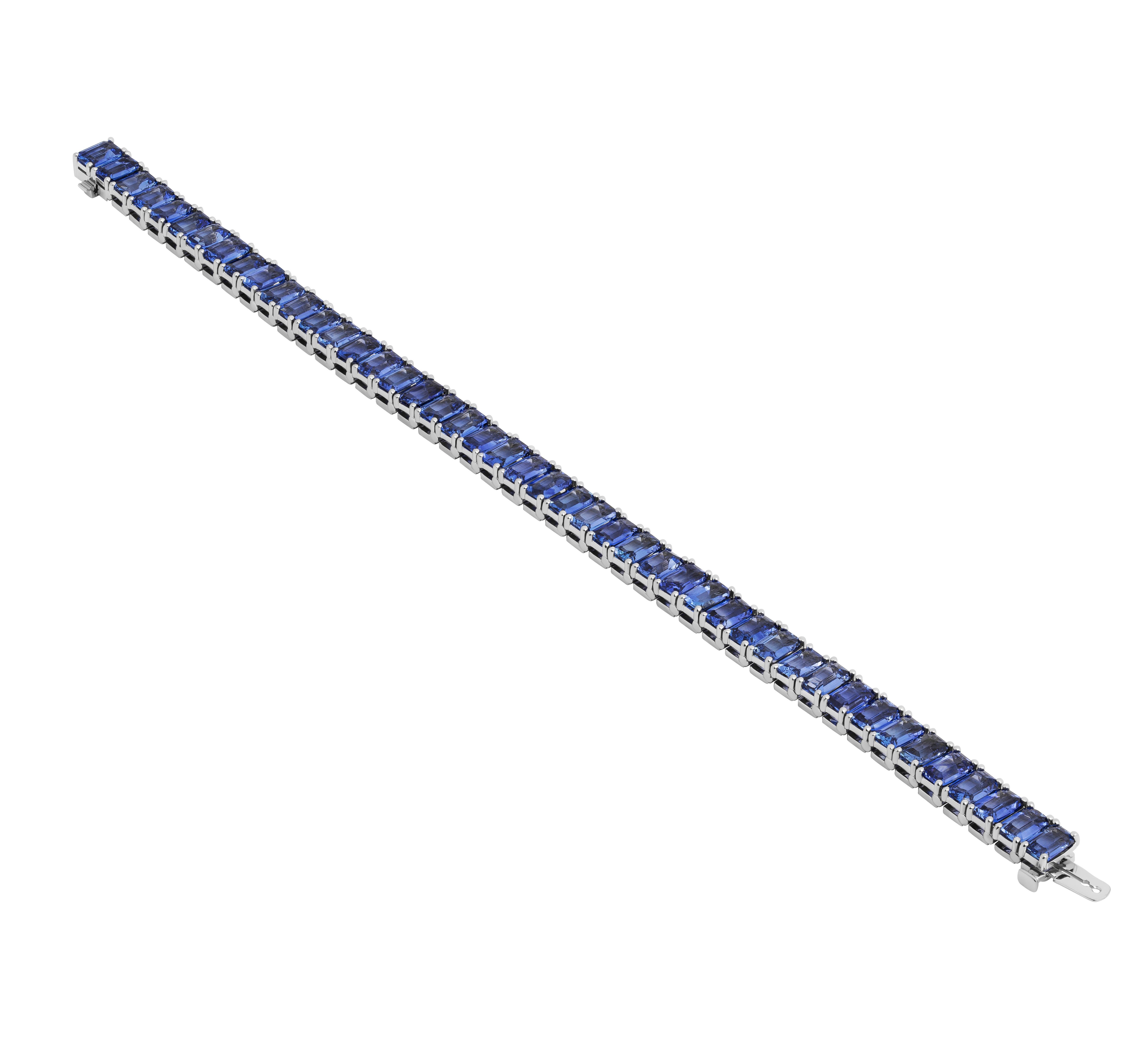 Modern Tennis Bracelet with Emerald cut Blue Sapphires For Sale