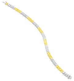 Tennis Bracelet with Fancy Yellow Radiant Cut and White Emerald cut Diamonds