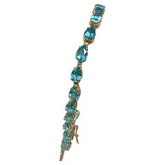 Tennis Bracelet with Pear-shaped Blue Topaz Gemstones, 14K Gold