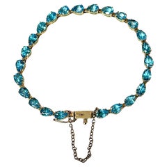 Tennis Bracelet with Pear-shaped Blue Topaz Gemstones, 14K Gold