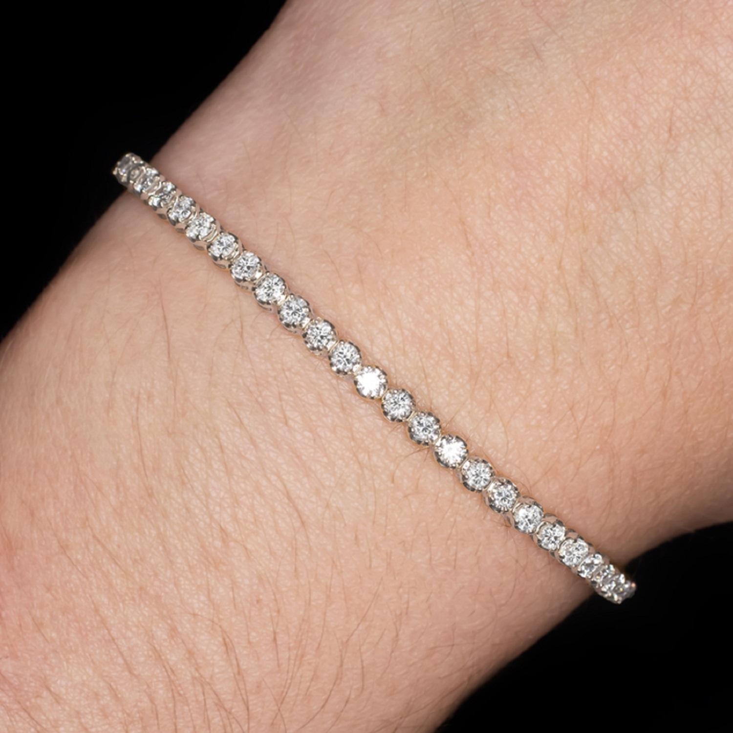 Brilliantly sparkling tennis bracelet has a classic design that will never go out of style! Featuring 3 carats of bright white, eye clean diamonds, this beauty offers brilliant, eye catching sparkle. The highly polished, curved settings give the