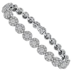 Bracelet tennis en or blanc avec grappe de diamants en grappe