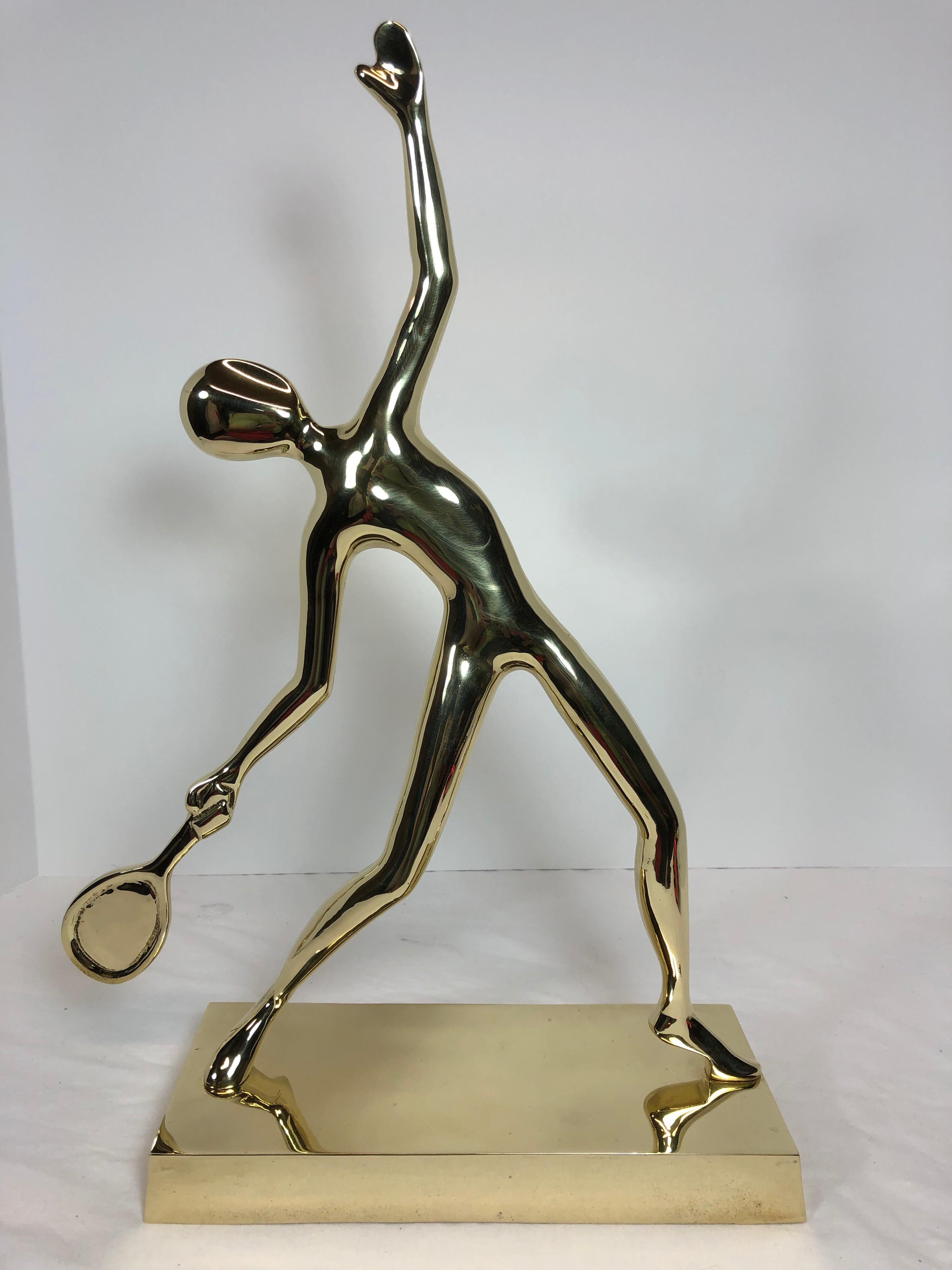 Very unique large polished solid brass abstract us open tennis player statue. Polished, ready to use.