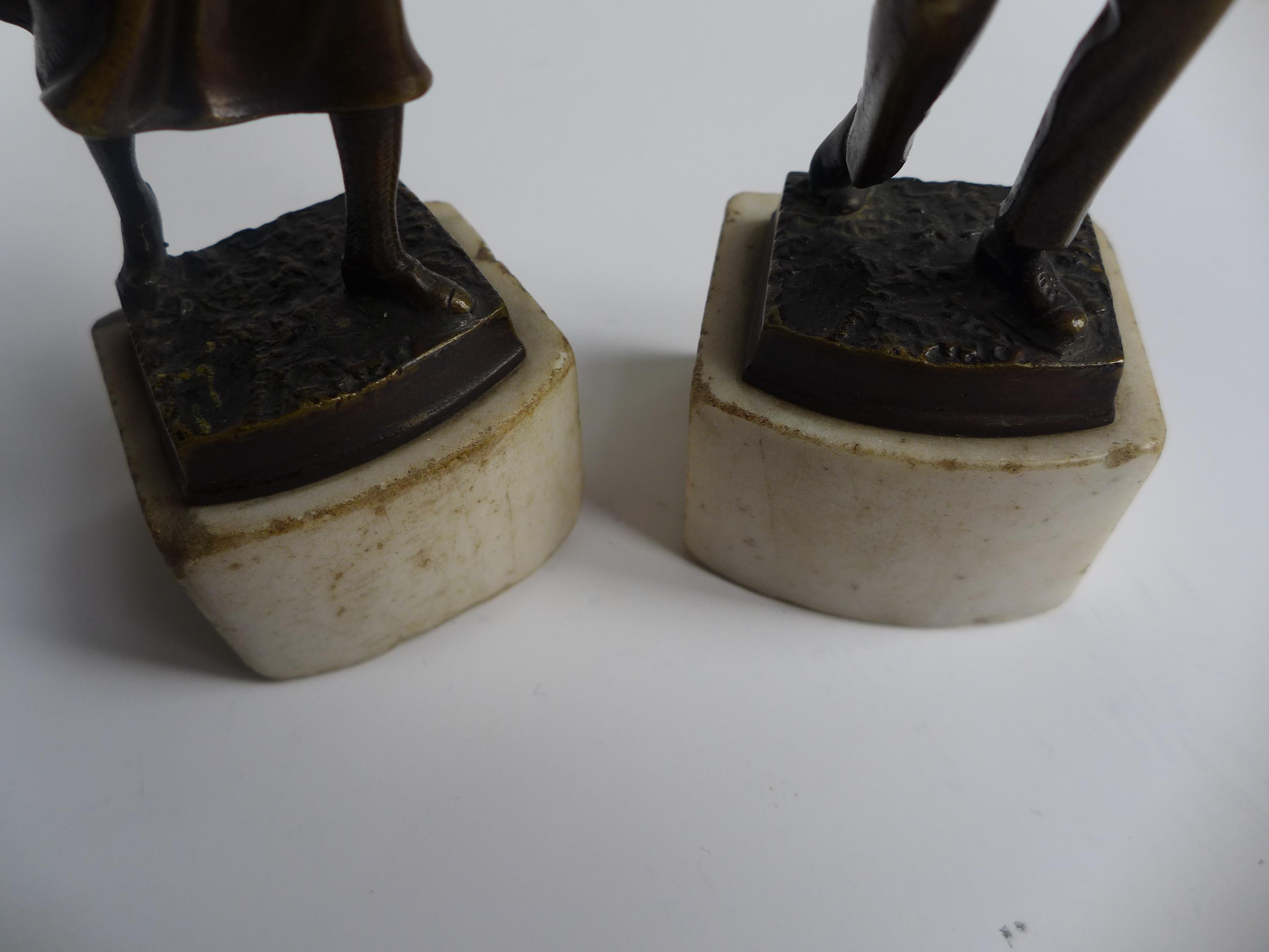 A gracefully composed Art Deco bronze from the 1930s depicting a couple engaged in a lively game of tennis. The figures capture a rare blend of movement and intimacy: athletic energy meets subtle romantic tension. The finely cast bronze stands on a