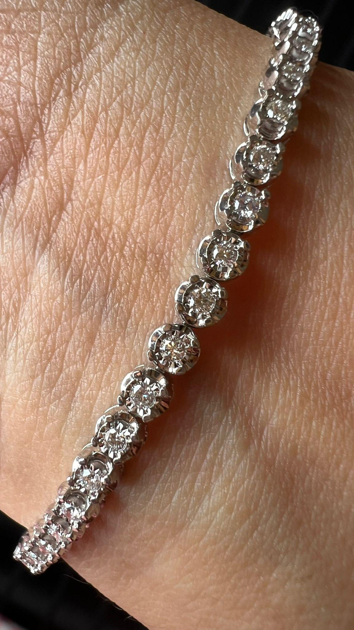 Tennis bracelet with all around diamonds made in 18kt White gold.

Each diamond is a little over 2 cent giving a larger look of 7 pointer diamonds.

A perfect value for money & an ideal bracelet for your daily wear, office wear.
A perfect gift to