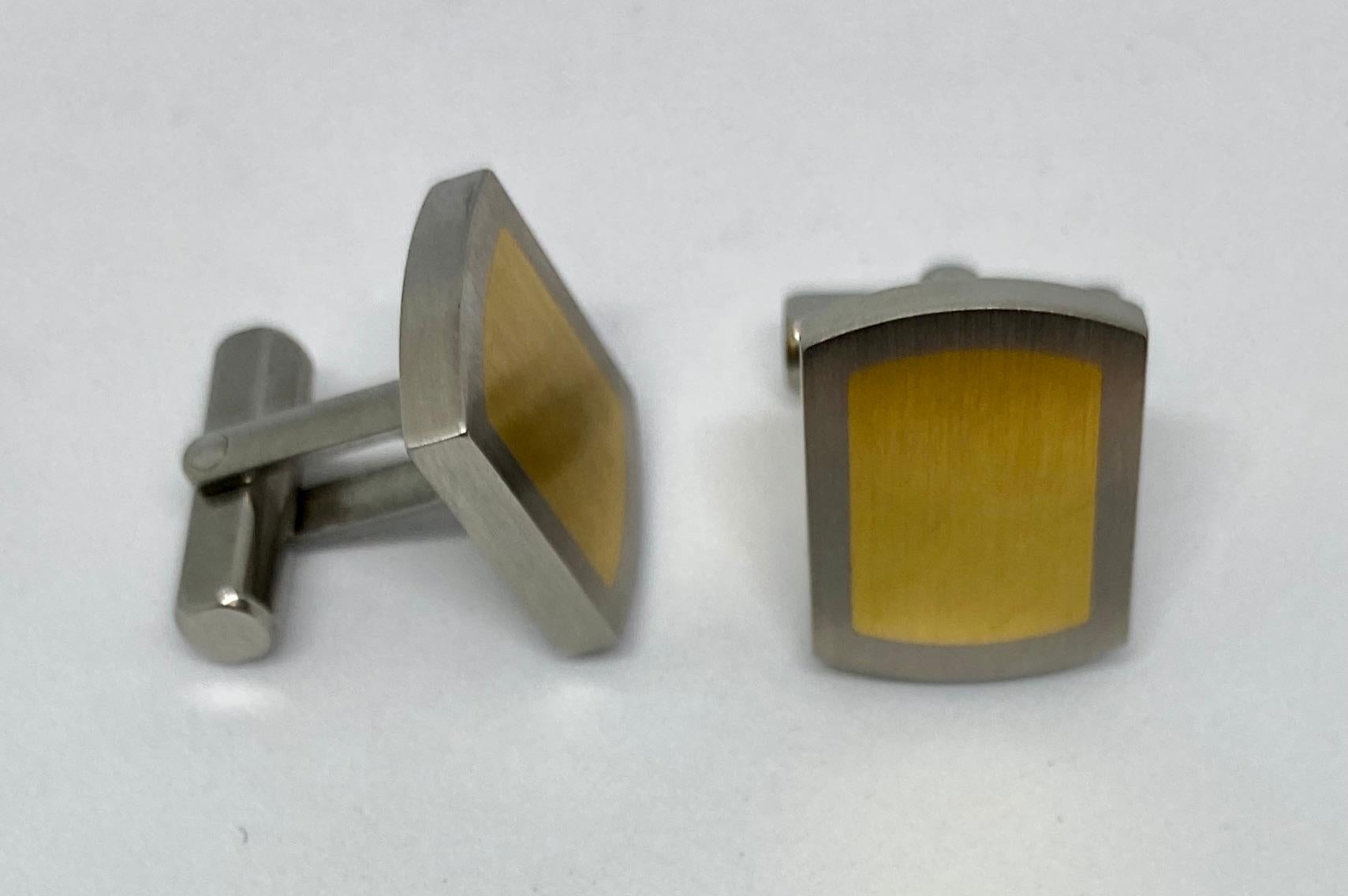 These contemporary cufflinks, designed and produced by TeNo in Pforzheim, Germany, are made of the highest quality, nickel-free stainless steel inset with 18K yellow gold.

They feature toggle backs, making them easy to insert and remove from the