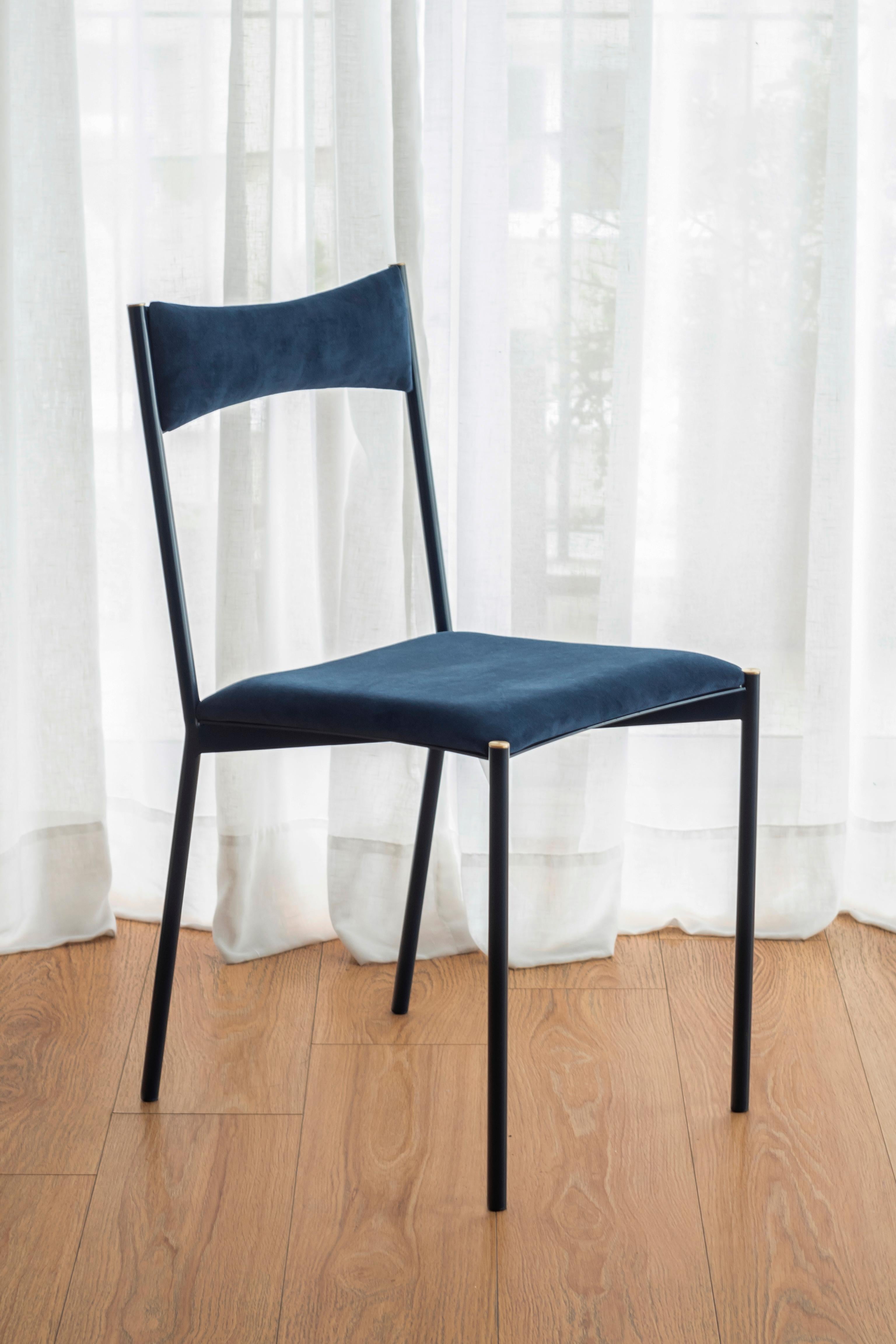 Tensa chair, dark blue by Ries
Dimensions: W 40 x D 49.5 x H 82 cm 
Materials: Round steel tube, laser cut metal sheet, high density foam, velvet upholstery, aluminum/bronze caps
Matte powder coated painting (Finishings)

Also available: Black,