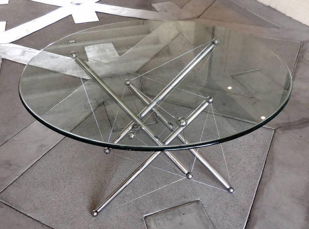 A dynamically charged Tensegrity dining table base (model 714) designed by Theodore Waddell for Cassina in 1973. 
The base is made of polished chromium-plated steel with steel tension wires that create a 