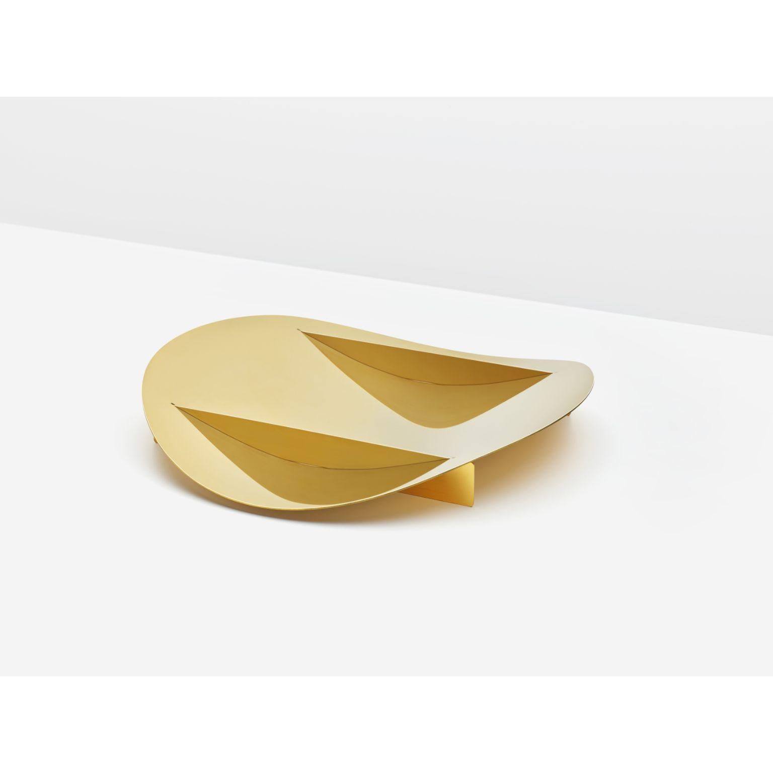 Tension Bowl by Paul Coenen
Dimensions: 40cm diameter, height approx. 6 cm
Materials: Handpolished brass

The Tension bowl is assembled from three brass parts, which are locked together due to the tension in the curved sheet. No screws, welds or