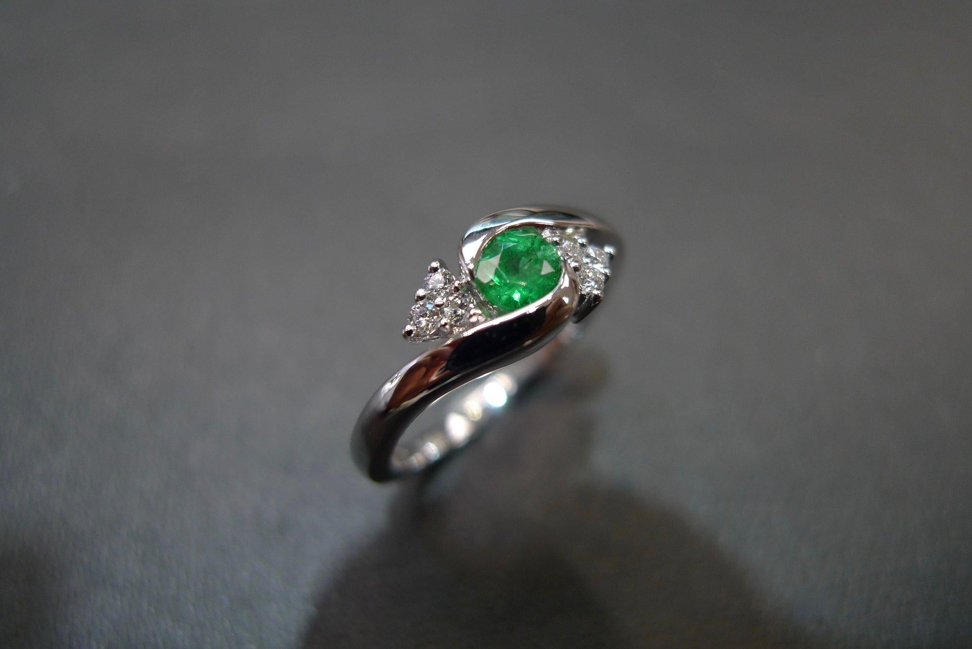 For Sale:  Tension Twist Round Cut Emerald and Diamond Engagement Ring in 18K White Gold 5