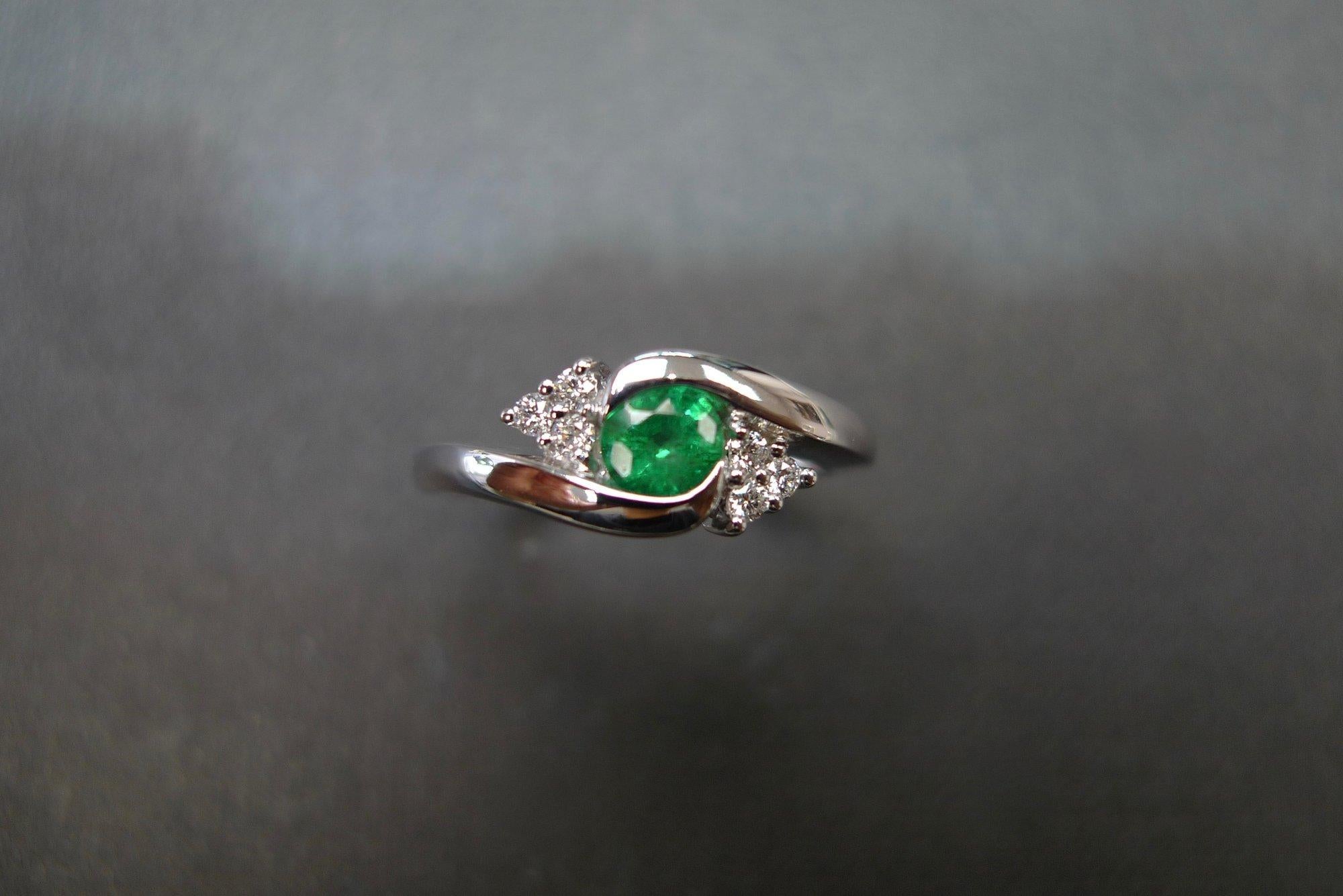 For Sale:  Tension Twist Round Cut Emerald and Diamond Engagement Ring in 18K White Gold 6
