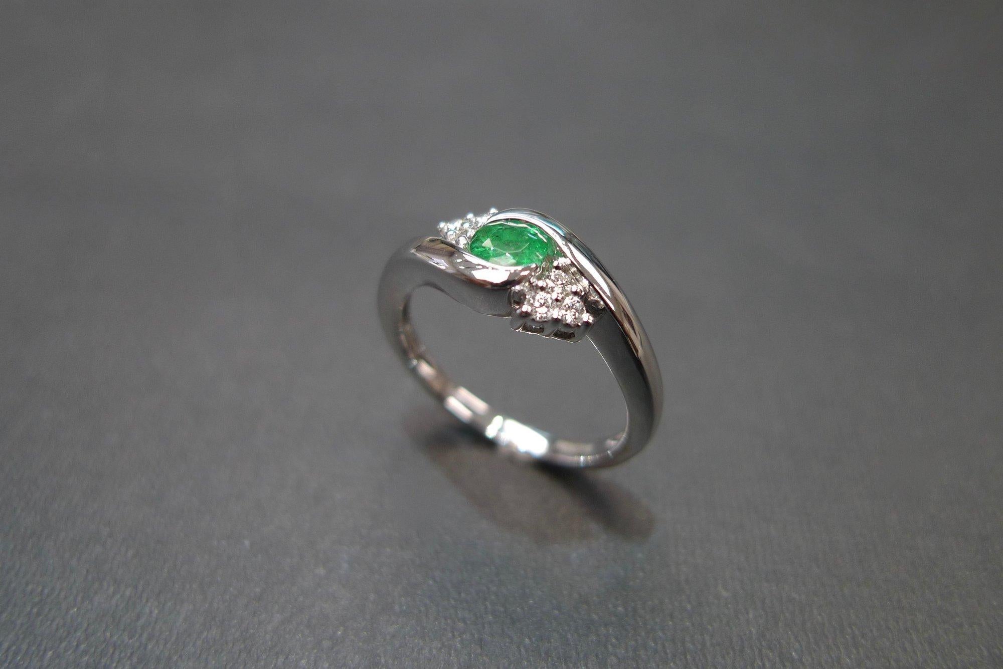 For Sale:  Tension Twist Round Cut Emerald and Diamond Engagement Ring in 18K White Gold 7