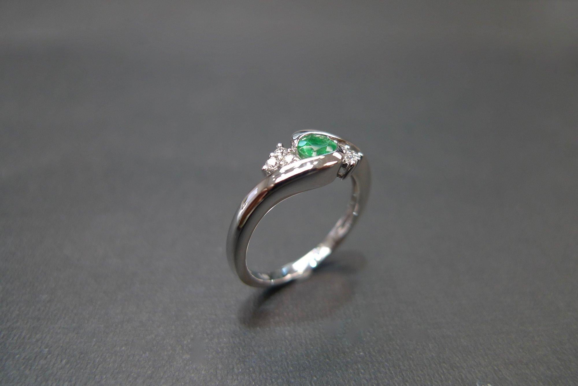 For Sale:  Tension Twist Round Cut Emerald and Diamond Engagement Ring in 18K White Gold 8