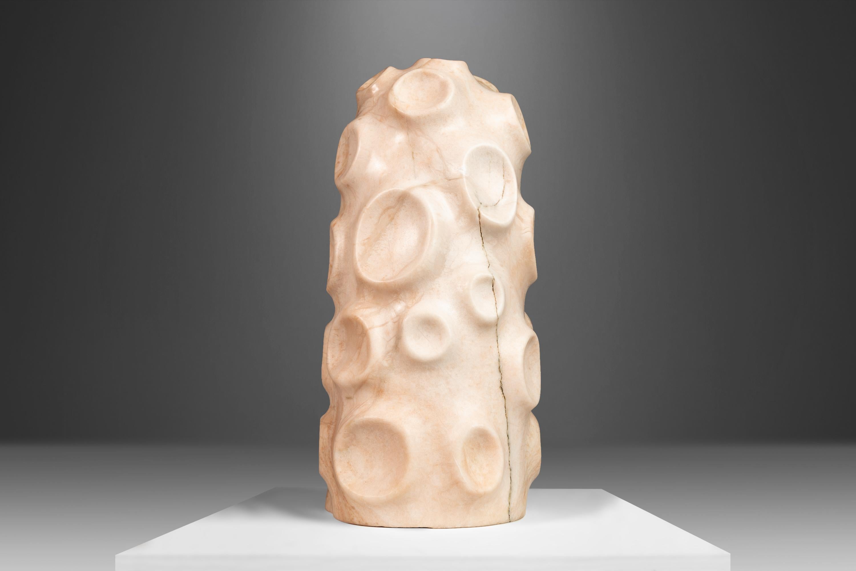 Hand-sculpted in pure, solid alabaster this fascinating sculpture is absolutely arresting from every angel. Sculpted by Mark Leblanc, an accomplished designer and craftsmen renowned for his Organic Modern pieces audaciously carved from all-natural