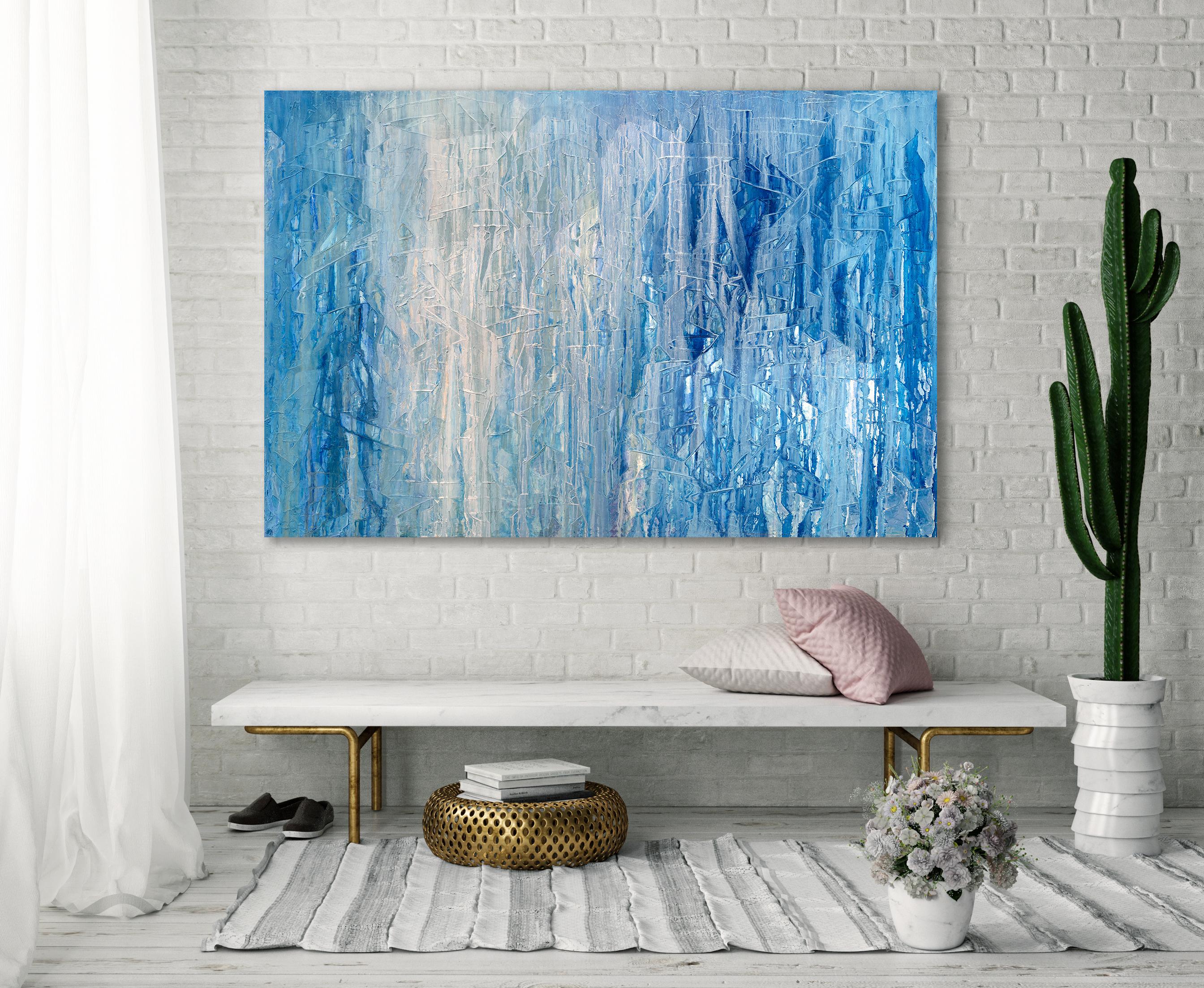 This large abstract painting by Teodora Guererra features a blue and white palette. Paint appears to drip over a textured under layer of the painting. It is created with oil paint on gallery wrapped canvas, and has clean, platinum painted sides. It