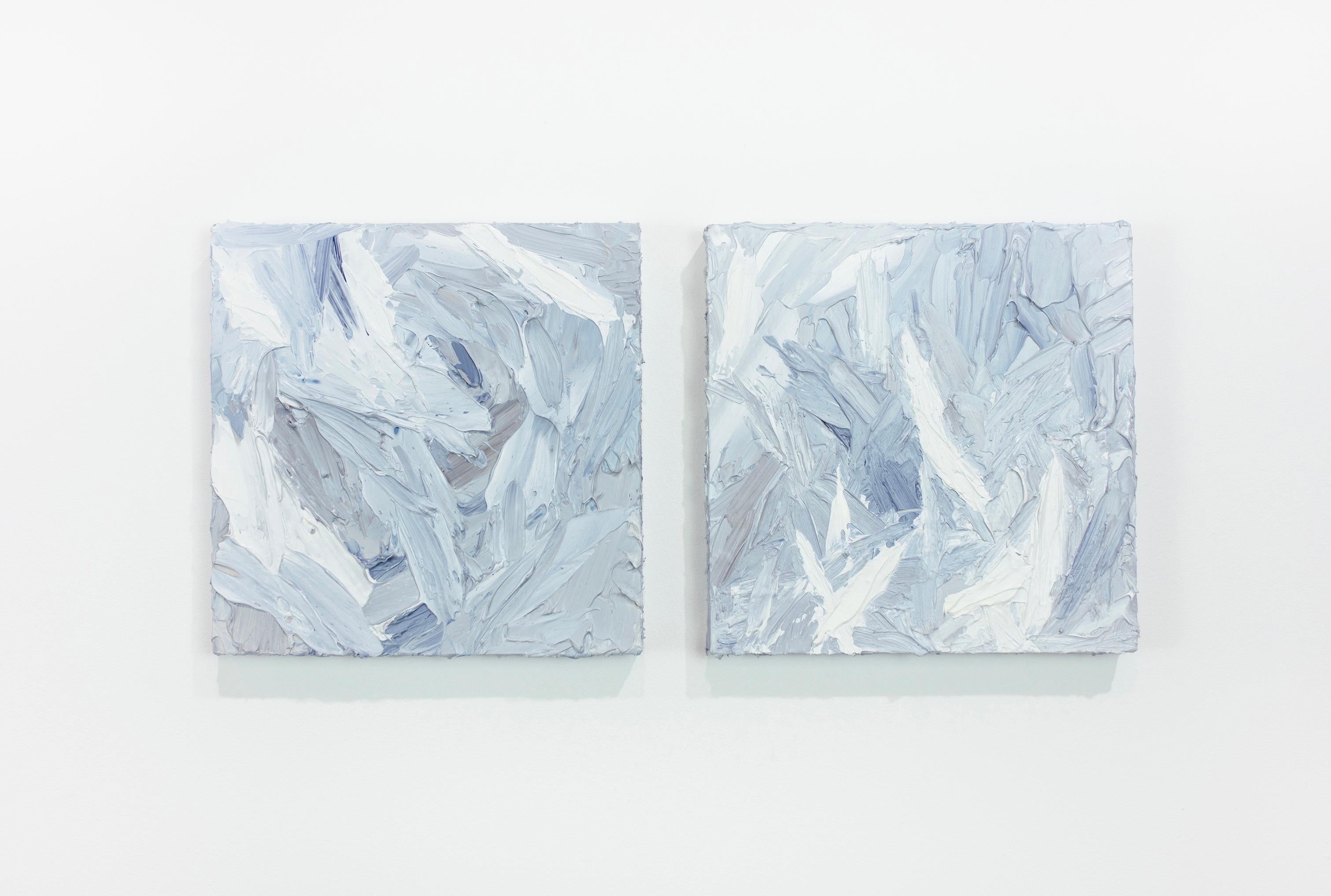 This textured abstract diptych by Teodora Guererra features a light blue, grey, and white palette. The artist layers thick strokes of paint using a palette knife over board, creating an abstract composition and highly textured finish on the surface.