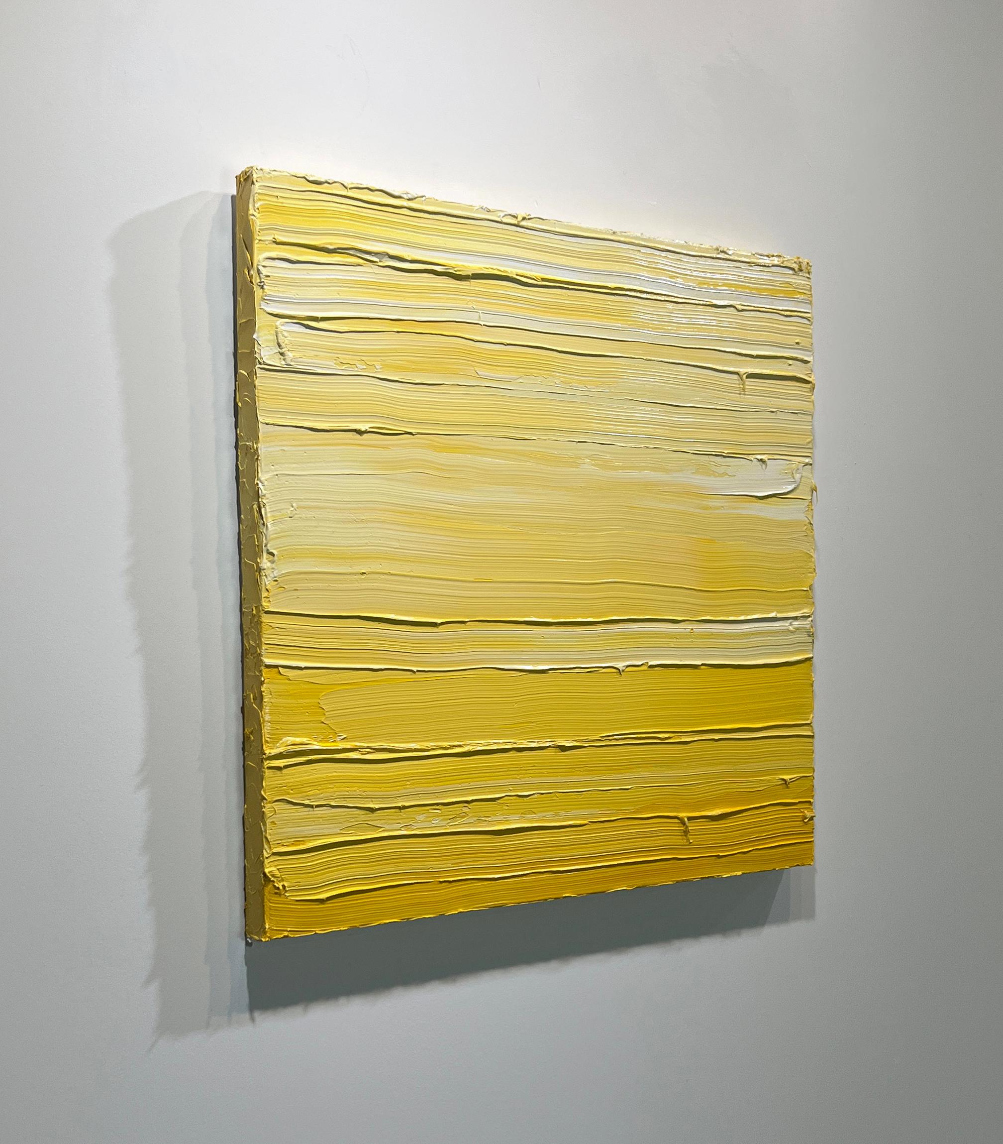 This contemporary abstract painting by Teodora Guererra features a bright yellow and white palette. The artist applies thick layers of yellow and white paint across the painting in horizontal gestures, giving the surface of the canvas texture. It is