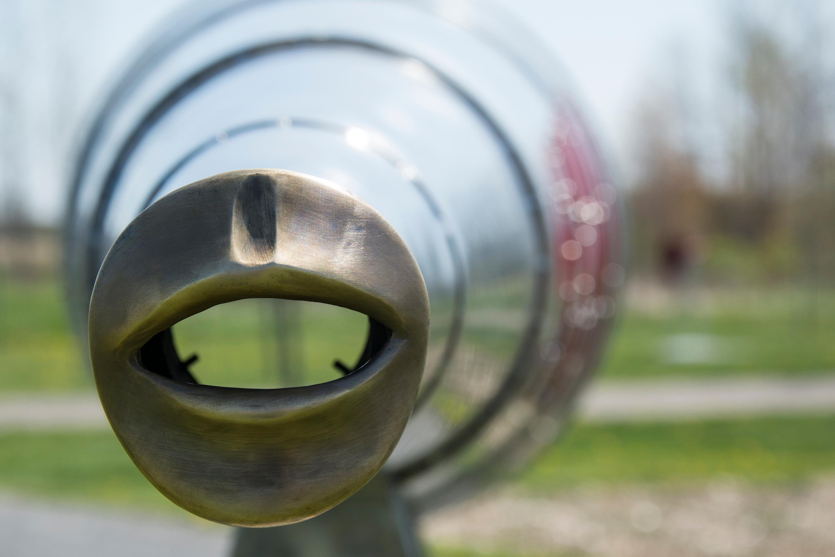Shout is an outdoor steel sculpture and the companion piece to Hear The World: speak or shout into the sculpture and hear your voice carried across the garden. The mouthpiece is made of brass, a hygienic material which prevents the growth of