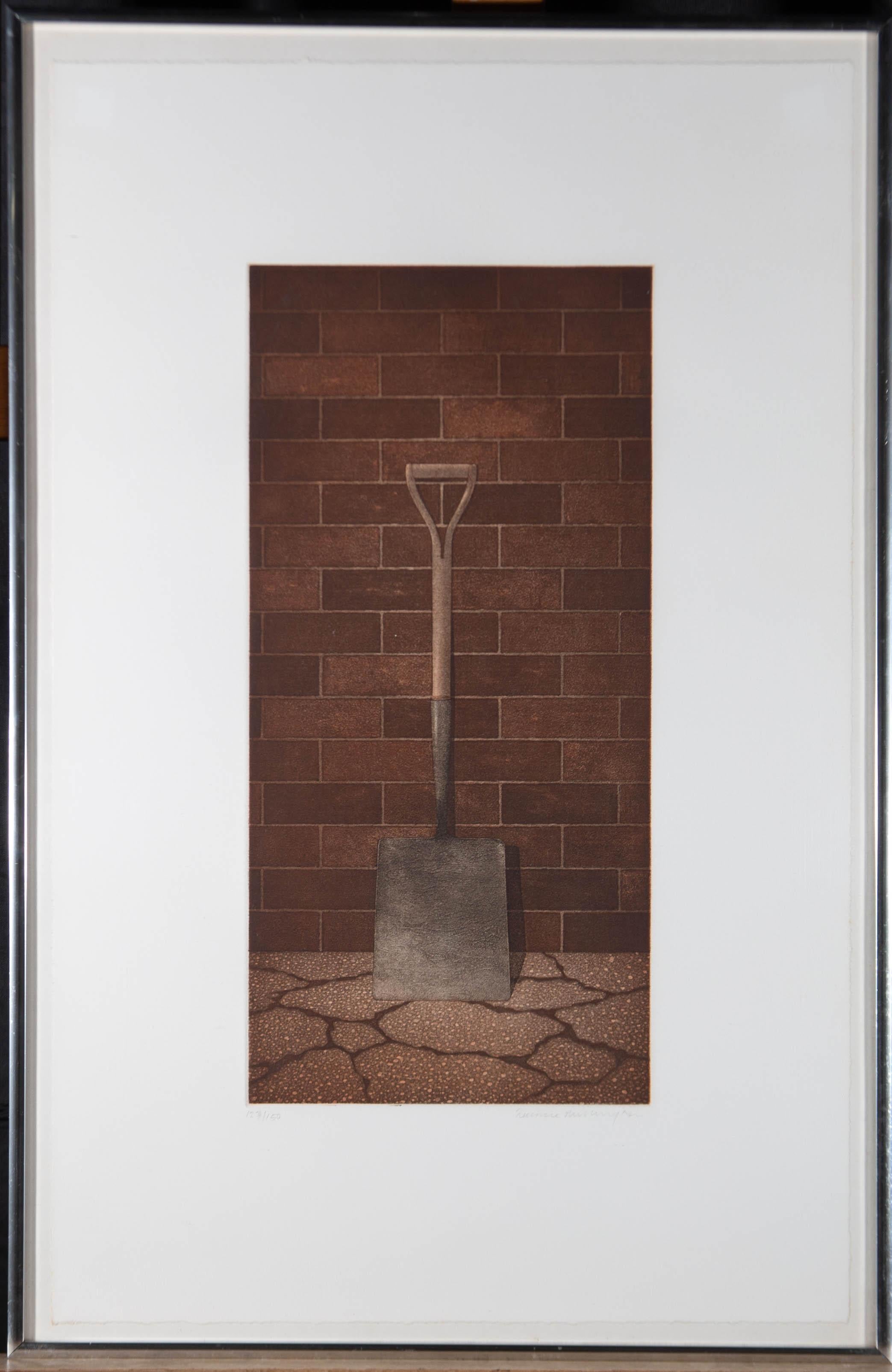 A simple and striking coloured aquatint showing a garden shovel propped against a brick wall. This fun still life is signed to the lower right and numbered at the lower left (123/150). It has been presented in a silver metal frame. On wove.

