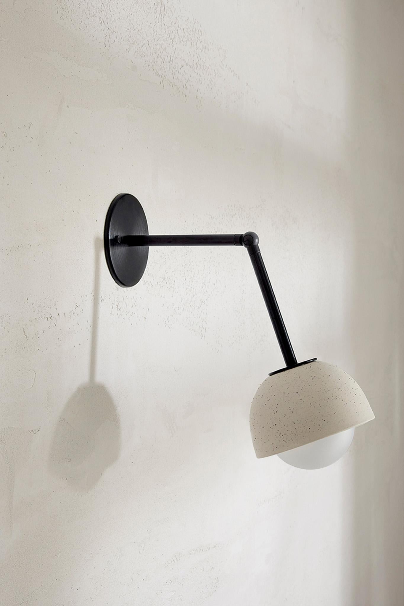 The Terra 0 Long Articulating Wall Light features a short or long articulating arm, the light is both directional and functional. The singular domed ceramic fitting creates a controlled light source. The Terra 0 Long Articulating Wall Light is