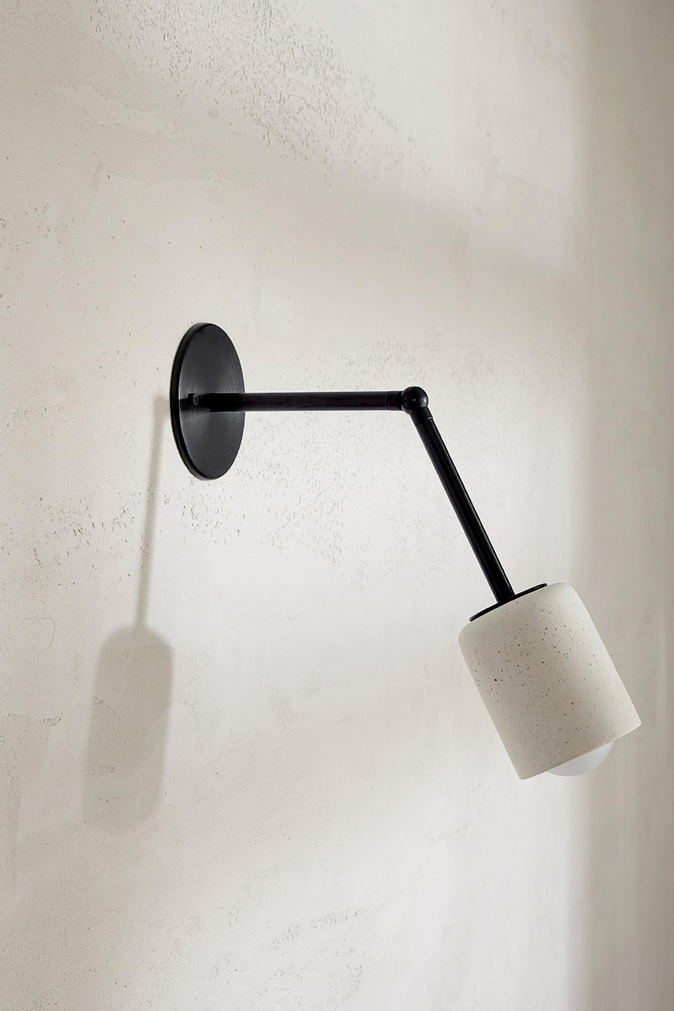 Simple cylindrical ceramic forms define the Terra 1 range, which comes in pendant light, surface, and long and short articulating wall light formats. The Terra 1 Long Articulating Wall Light is available in a choice of three tones – Slate, Sage and