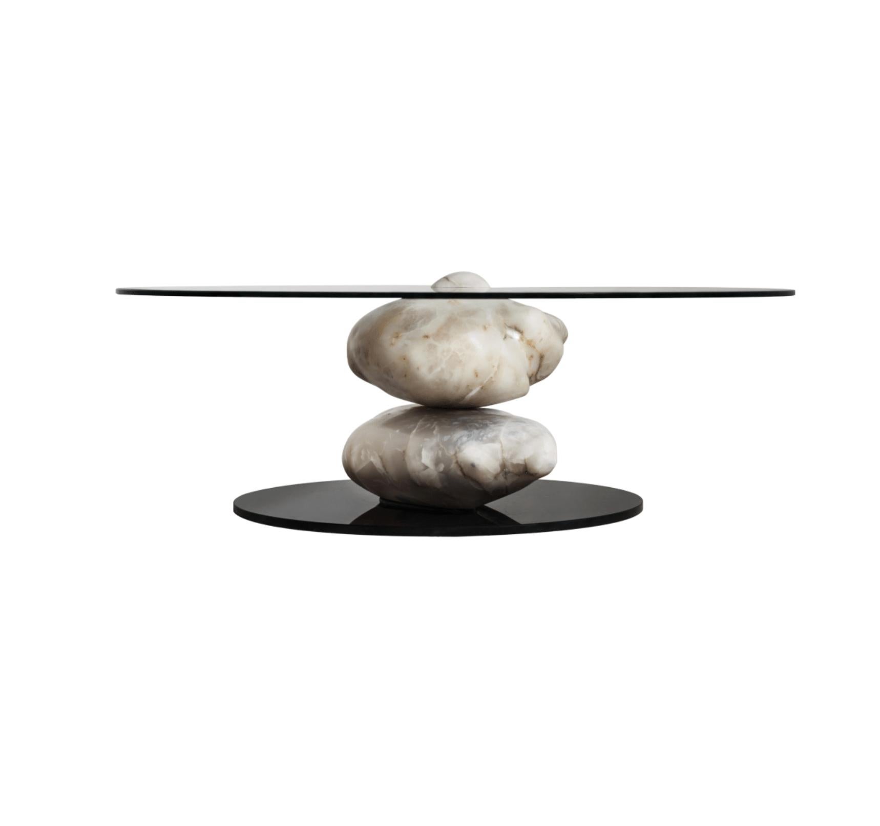The Terra coffee table collection is composed of blocks of hand polished Alabaster Stone. The stones are carefully positioned and balanced to support a crystal base. A unique piece that reflects an organic essence and a minimalist character.

The