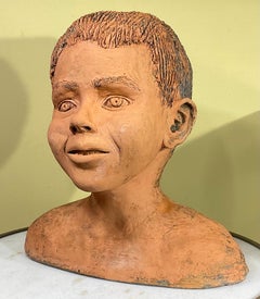 Buste d'un beau enfant en terre cuite, signé M.D