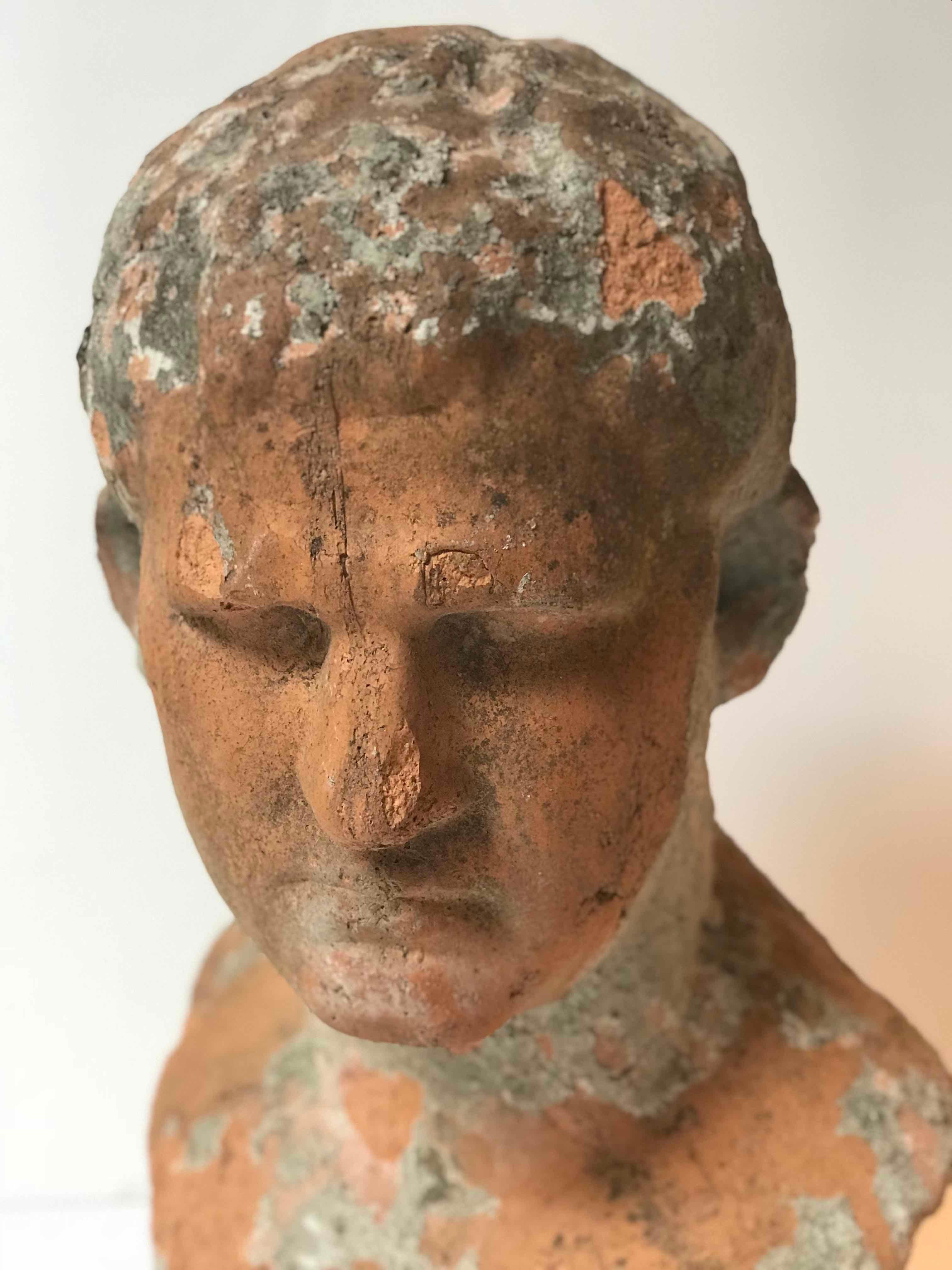 Terra cotta bust of man with cement remnants from France. 