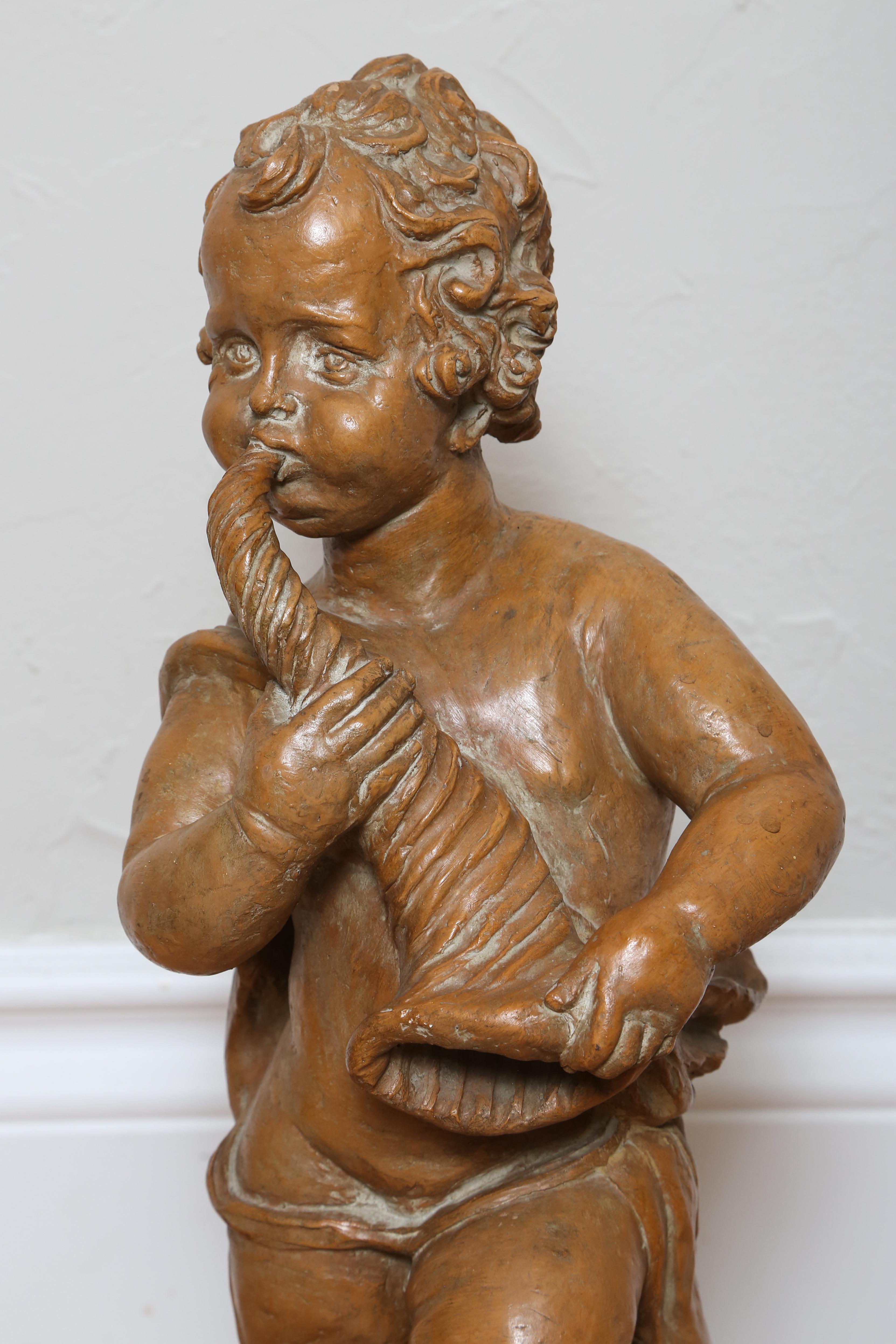 Terra Cotta Cherub with Horn In Good Condition For Sale In West Palm Beach, FL