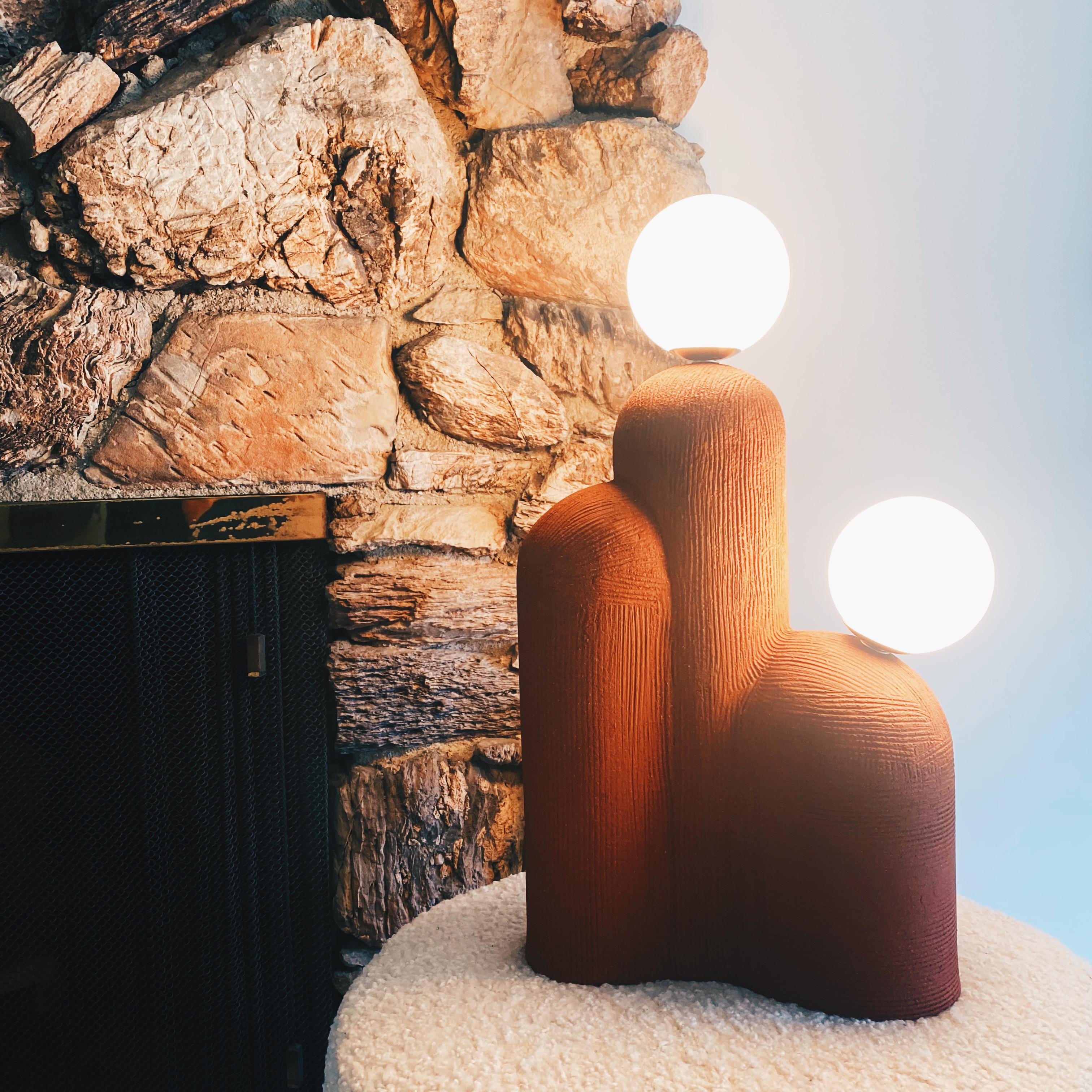 Terra Cotta cylinder lamp by Olivia Cognet
Materials: Ceramic.
Dimensions: D 45 x H 50 cm

Since moving to Los Angeles in 2016, French artist and designer Olivia Cognet has focused on ceramics as the fertile medium through which she expresses