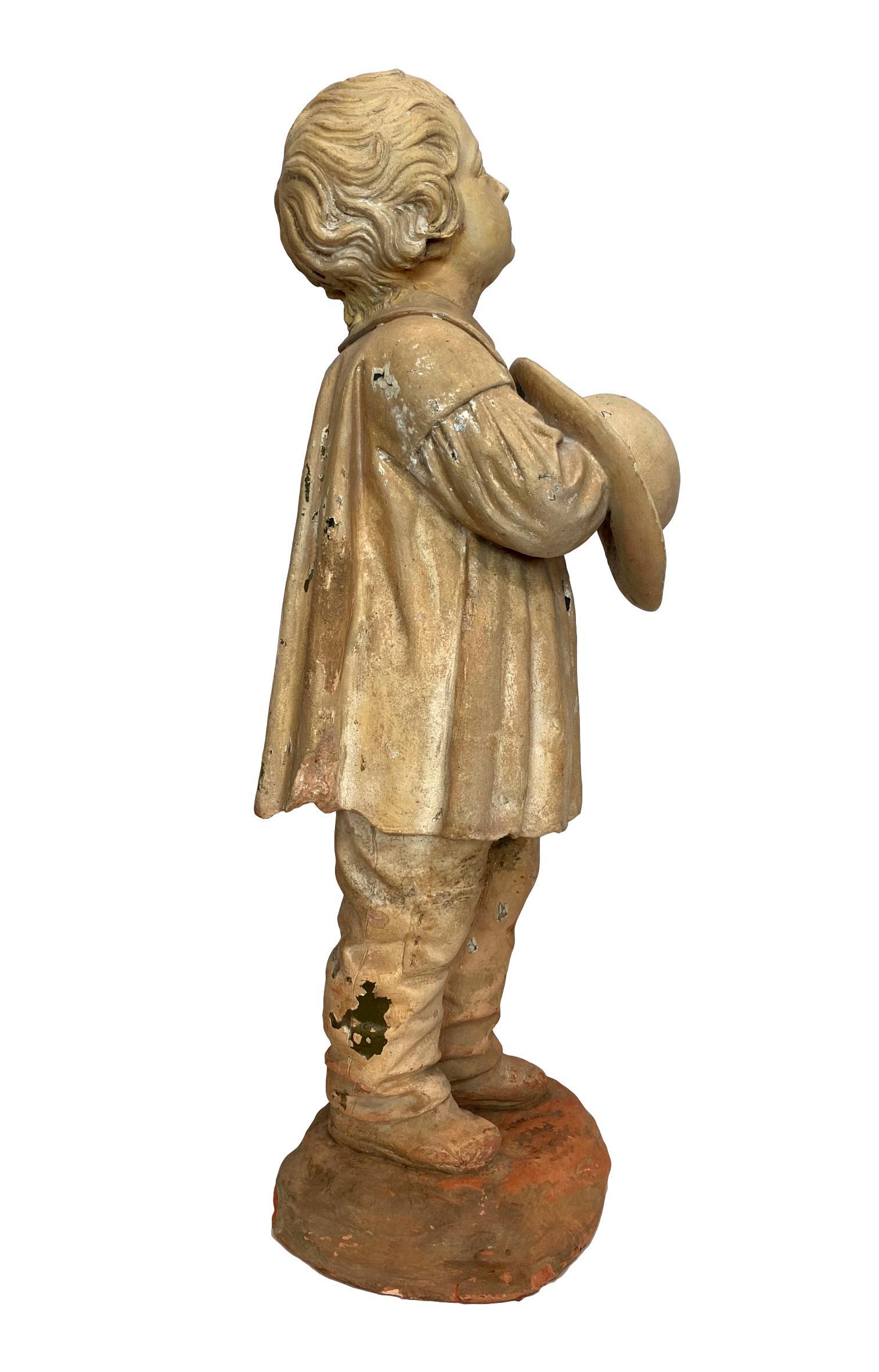 Molded Terra Cotta Figure of a Boy with Hat, French, ca. 1890