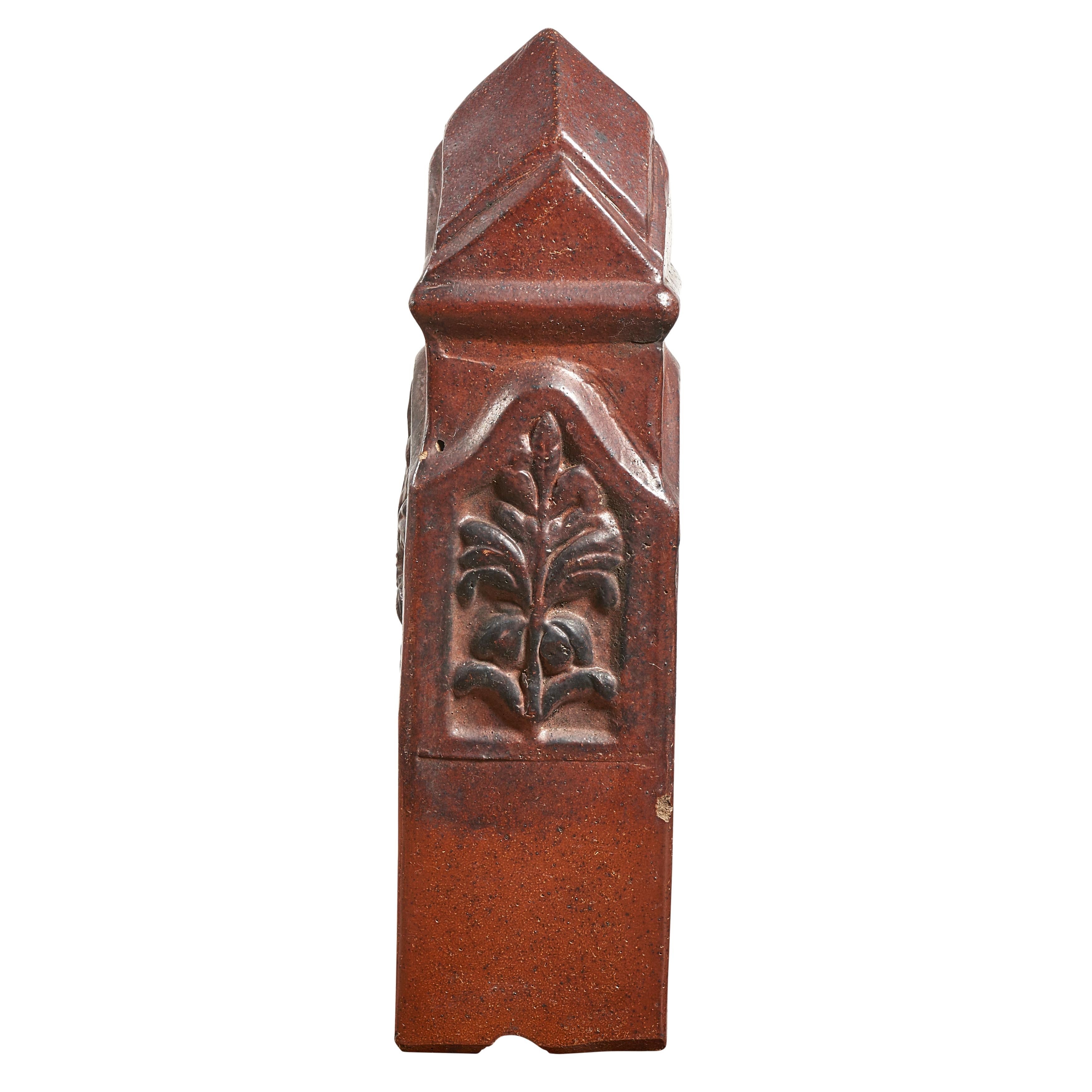 Glazed terra cotta garden boundary post with floral design. Multiples available.