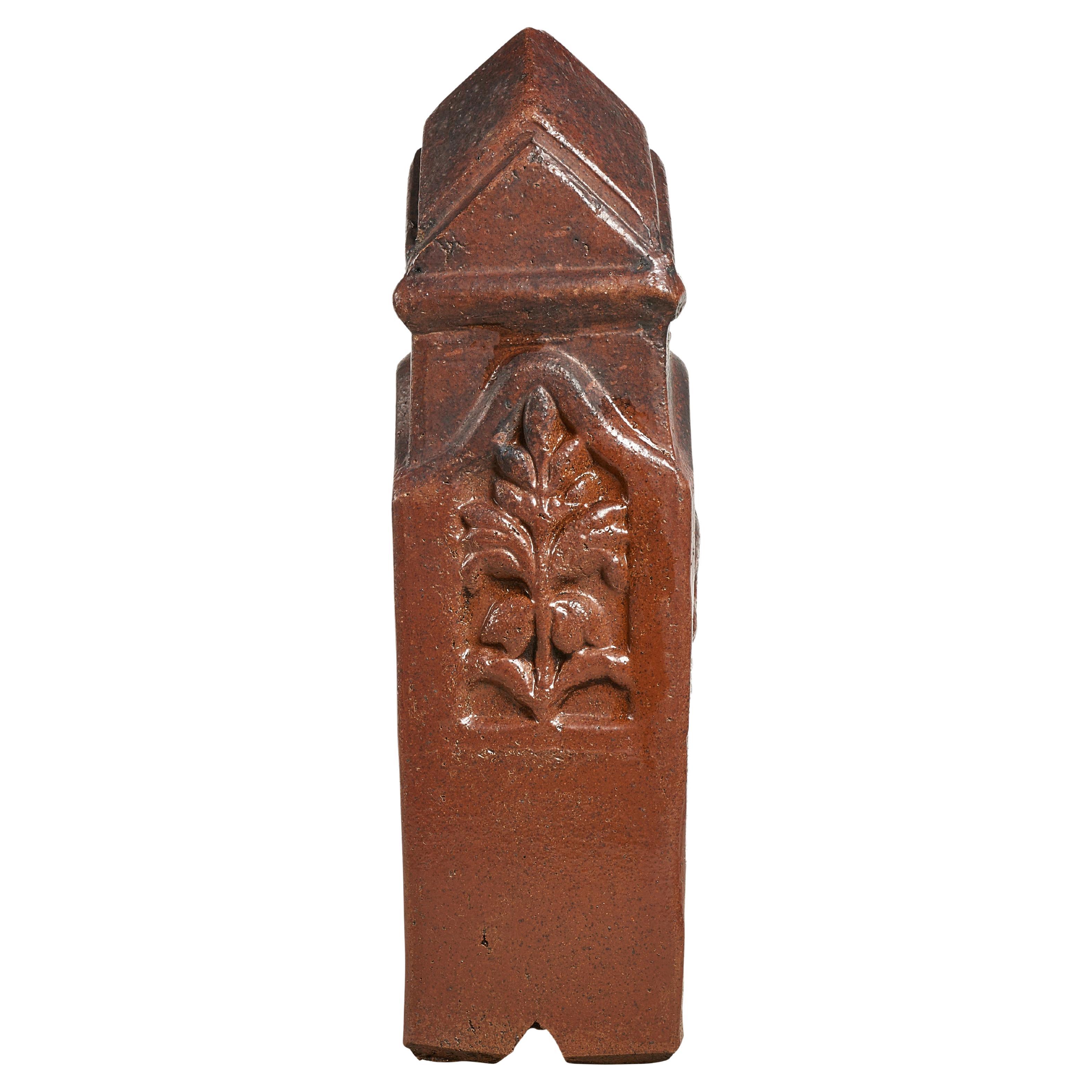 Glazed terra cotta garden boundary post with floral design. Multiples available.
