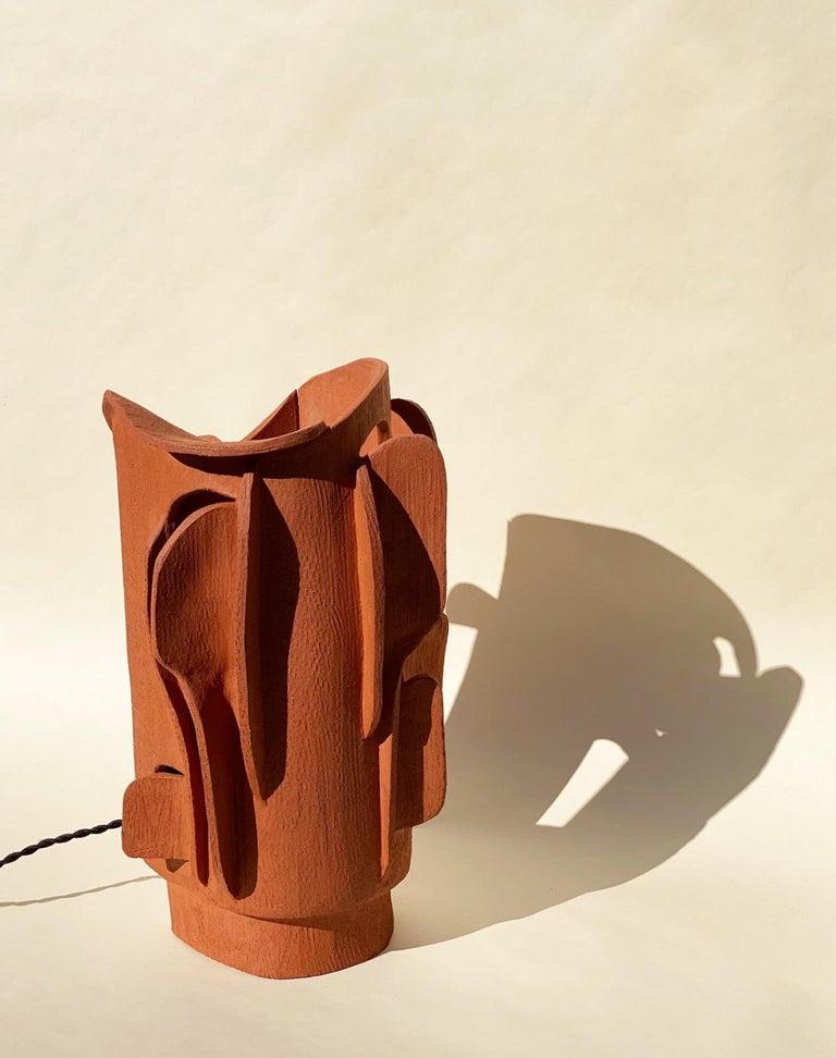Terra cotta lamp by Olivia Cognet
Materials: Red clay
Dimensions: H around 40-50 cm tall 

Each of Olivia’s handmade creations is a unique work of art, the snapshot of a precious moment captured in a world of fast ‘everything’.
Since moving to
