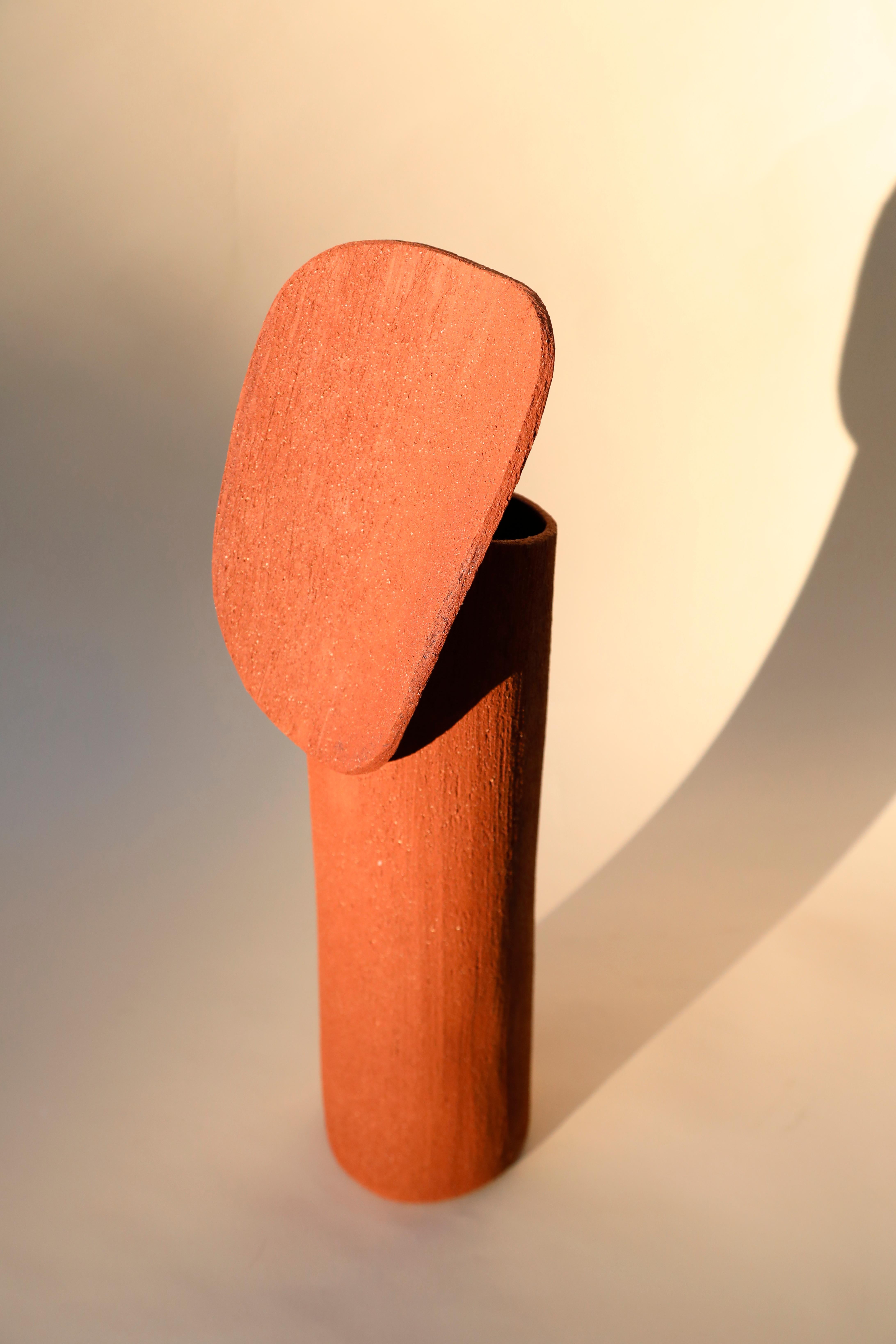 Terra cotta large Totem by Olivia Cognet
Materials: Red clay
Dimensions: H around 55-60 cm

Totem
Vases, lamps and sculptures with graphic forms, made from red clay that gives them a rough look..

Each of Olivia’s handmade creations is a
