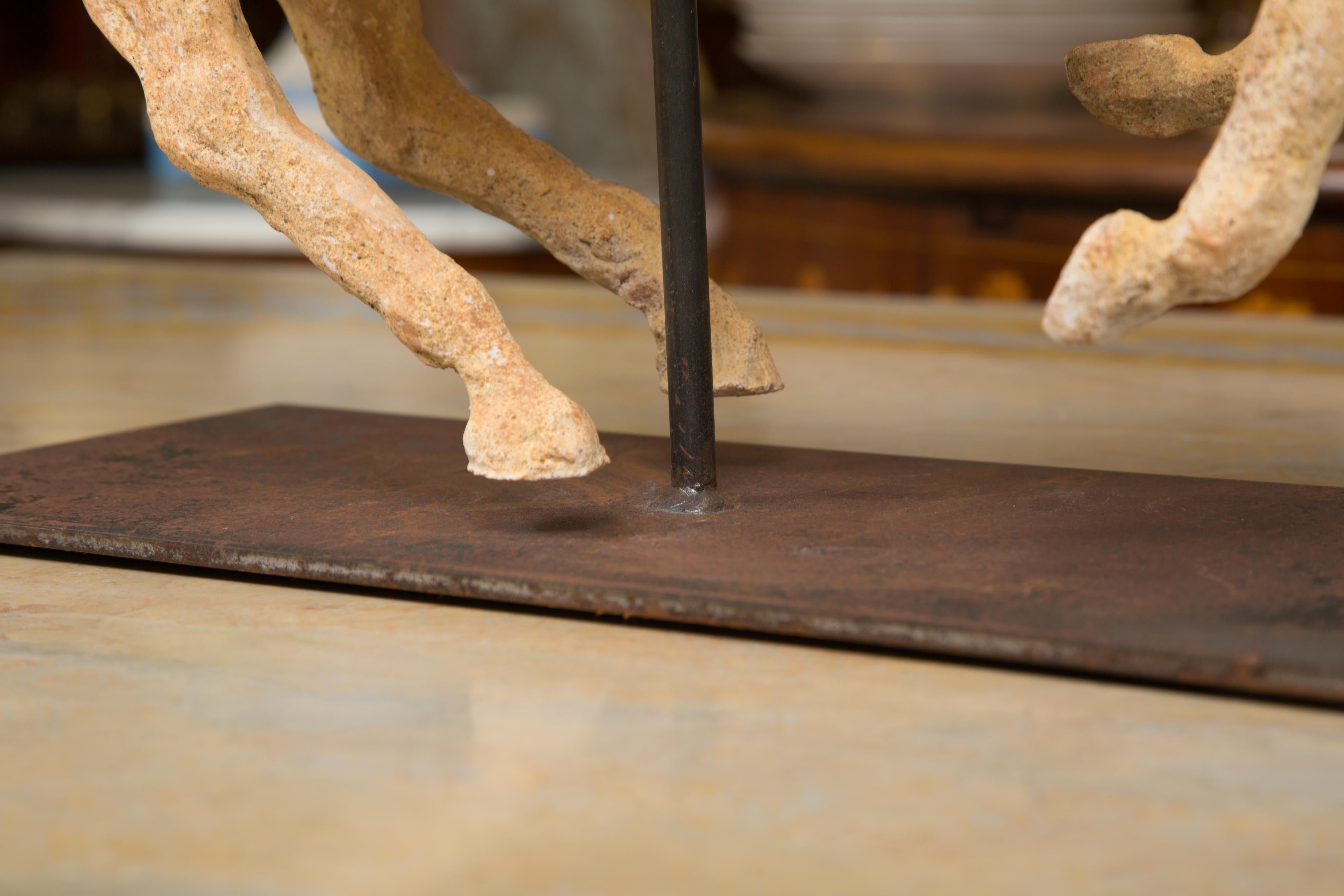 Terracotta Polo Player on a horse mounted on a Metal Stand by 