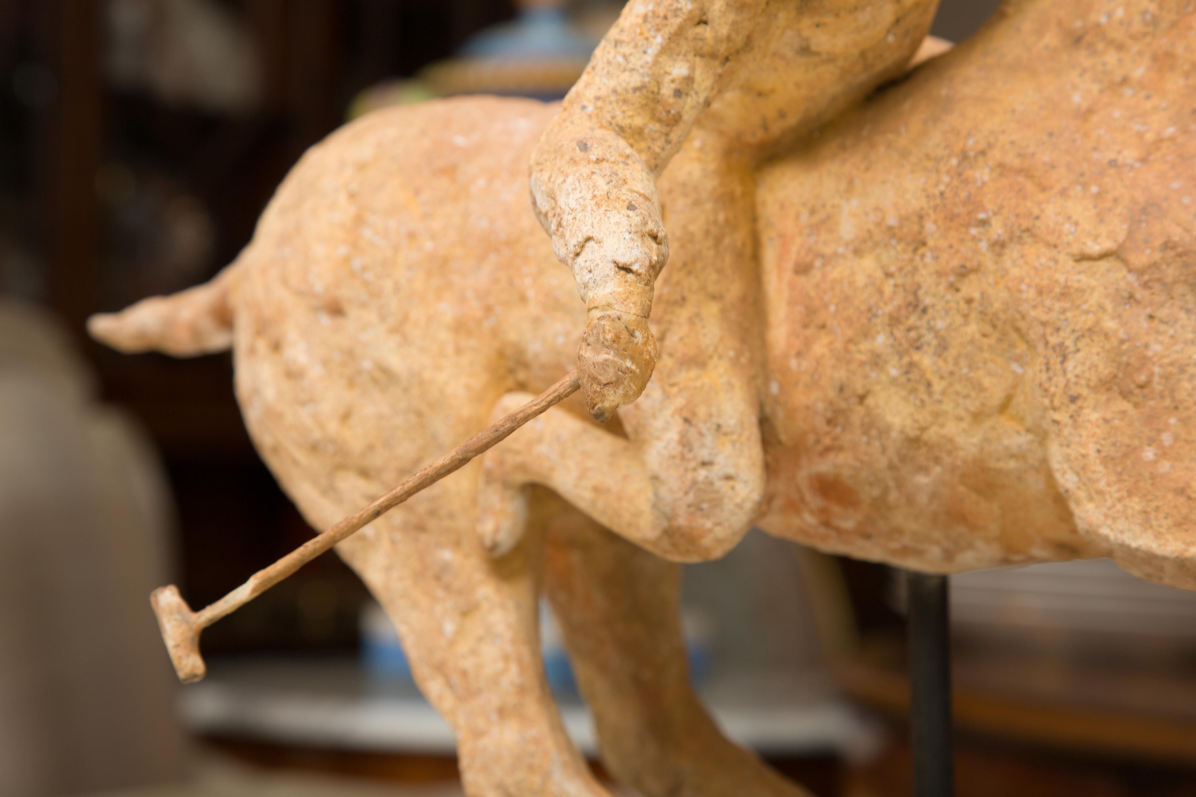 Terracotta Polo Player on a horse mounted on a Metal Stand by 