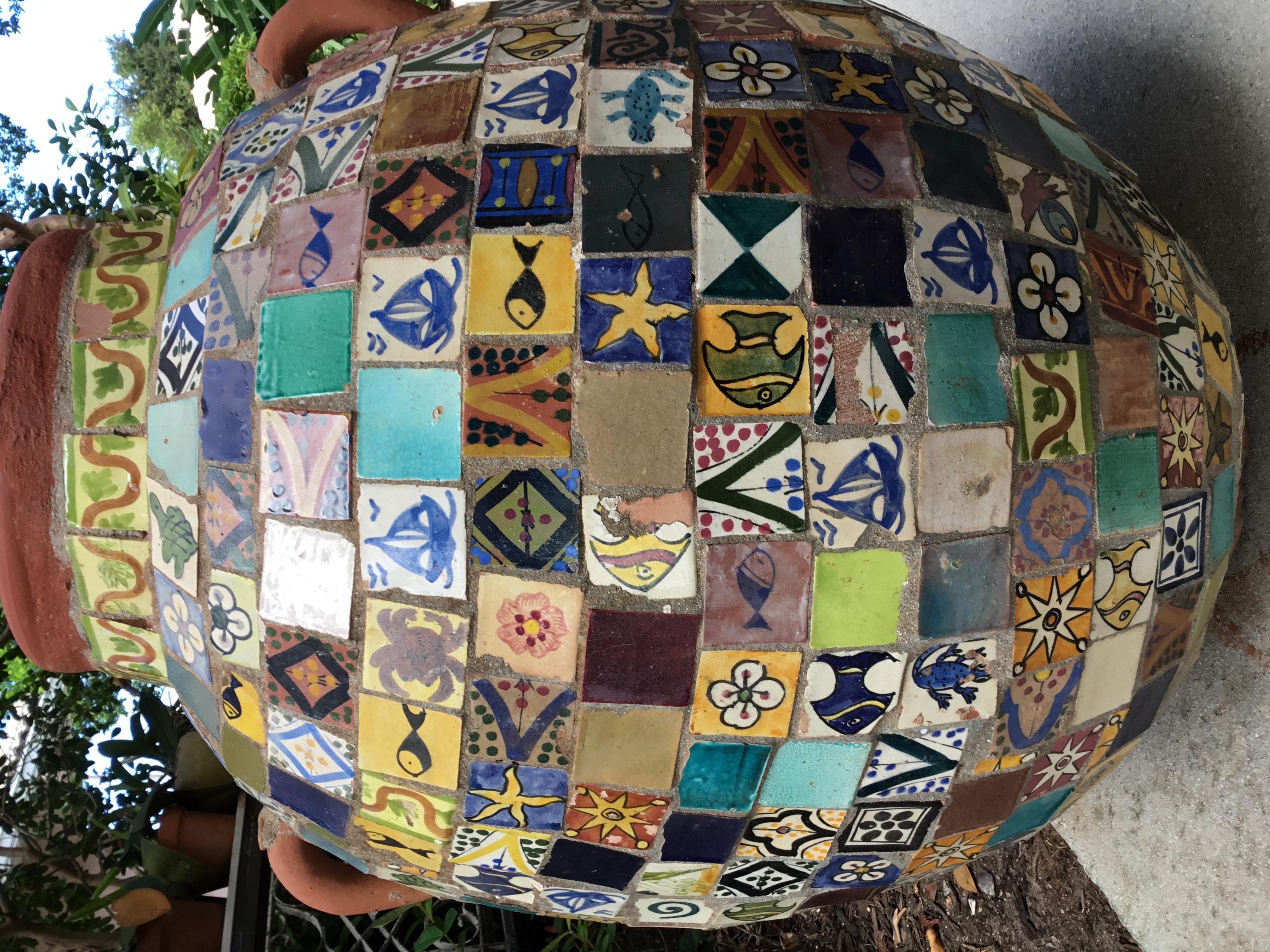 One of a kind grade vase made of terracotta, embedded with vintage hand painted ceramic tile all-over to make one fantastic object of art for display. Beautiful tiles with many motifs and colors
Made this piece a decorative indoor or outdoor use.