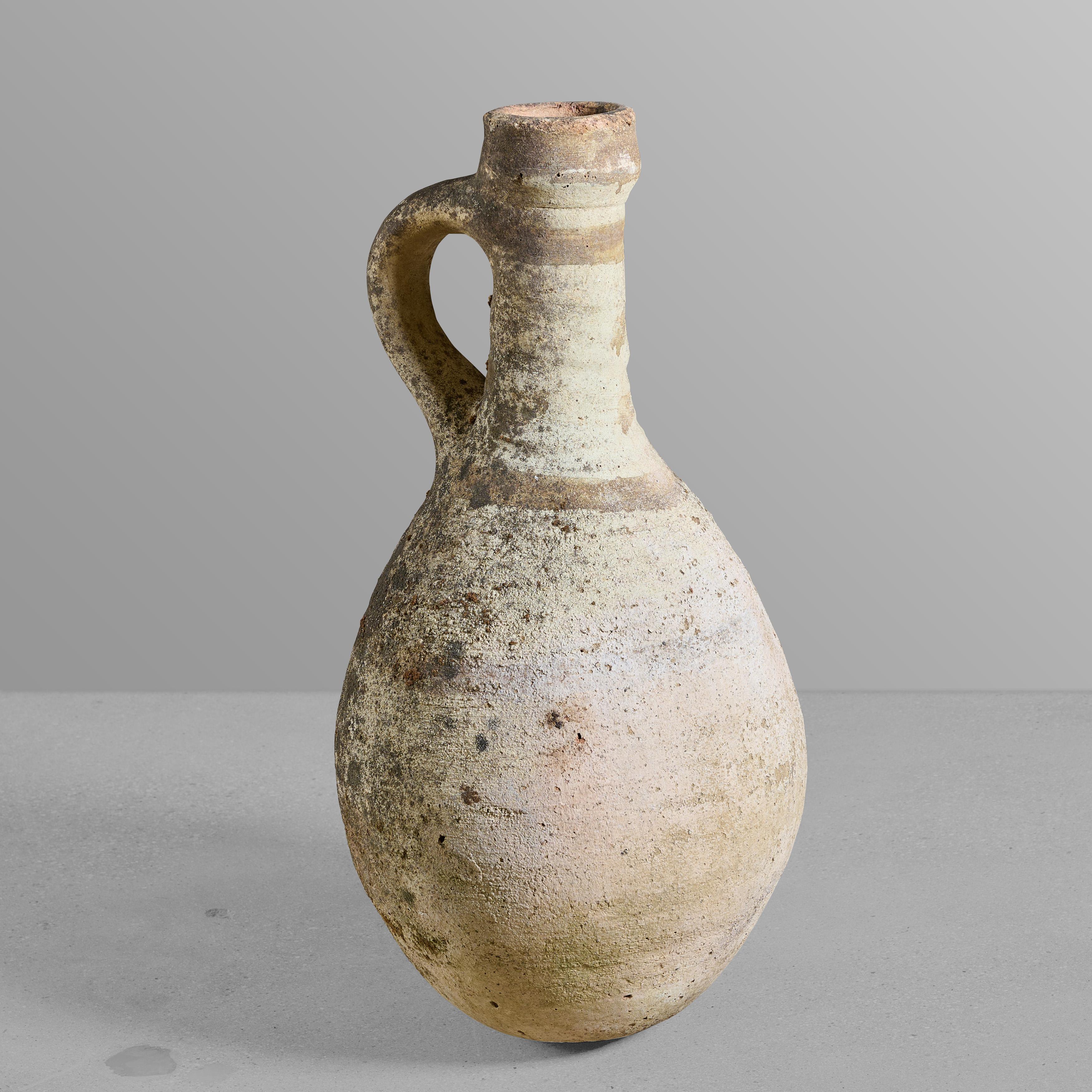 Ancient terra cotta wine vessel with the best patina.