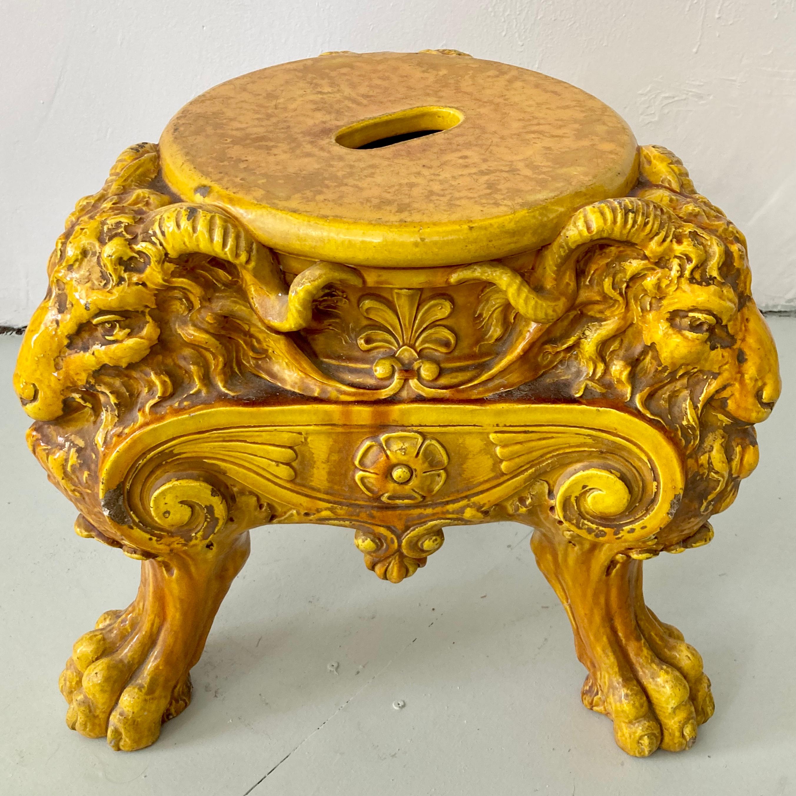 Fabulous terra cotta yellow garden seat with ram motifs. Great quality and detail. Use inside or out and add some European flair to your home . Great architectural details with the design too and the color is amazing. 
