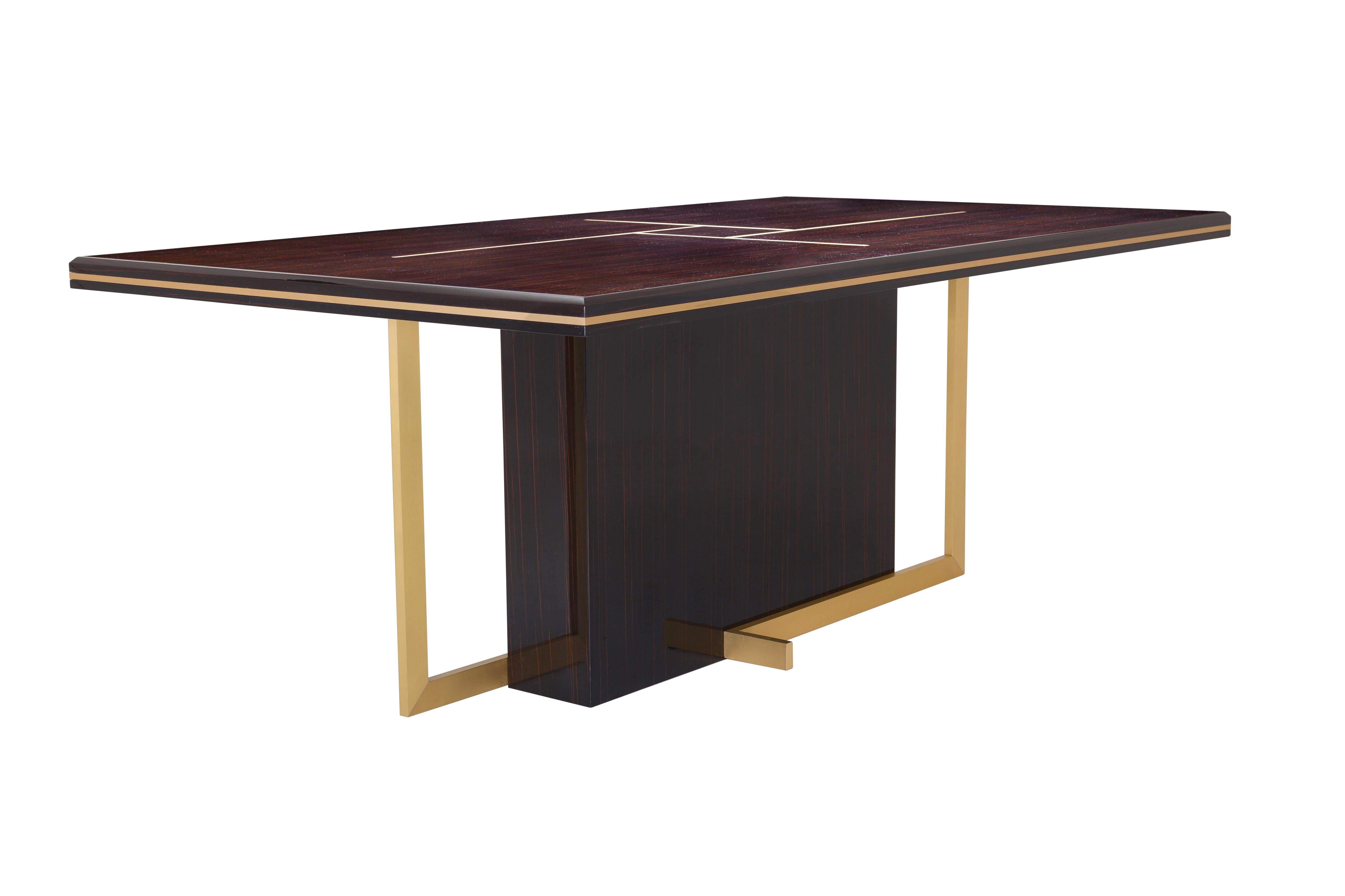 Eclectic and very elegant, this dining table embraces sensuality in decoration, combining wood and metal textures and keeping the balanced design.

Glossy Ebony Makassar veneer top and brushed Brass base and trimmings.
   