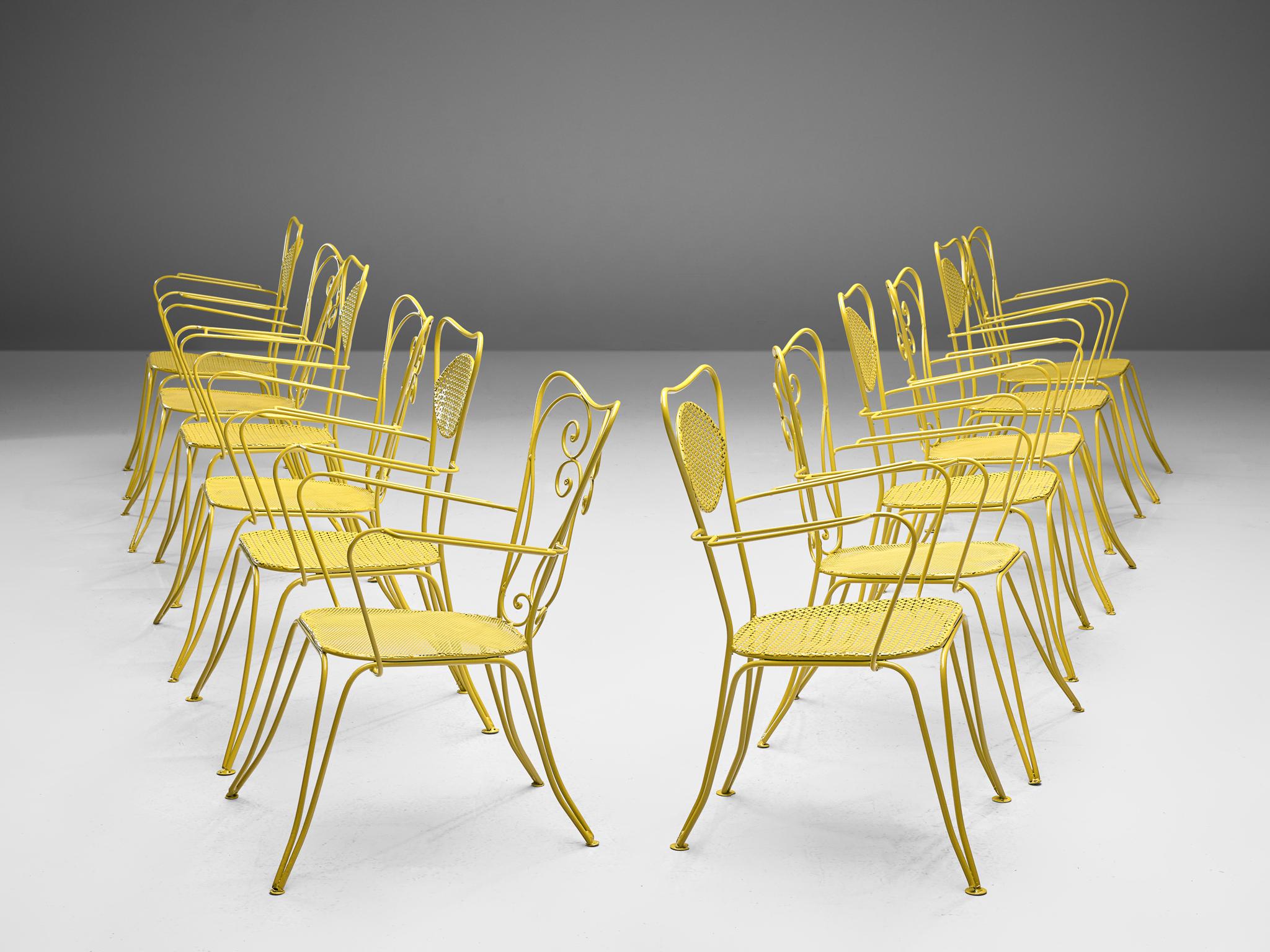 Large set of dining chairs, yellow colored metal, Italy, 1960s

Very large set of metal chairs in a vibrant yellow color. The chairs have an elegant, bold design, as is quintessential of Italian patio chairs. Curved shapes and thin armrests form the